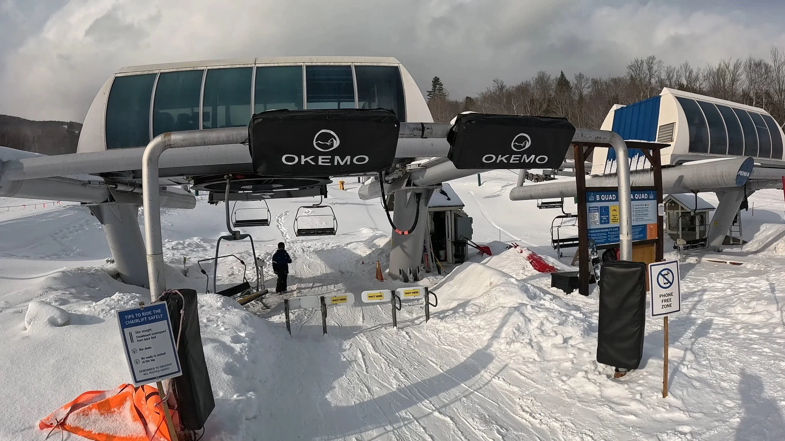 Quad chairlifts at Okemo ski resort.
