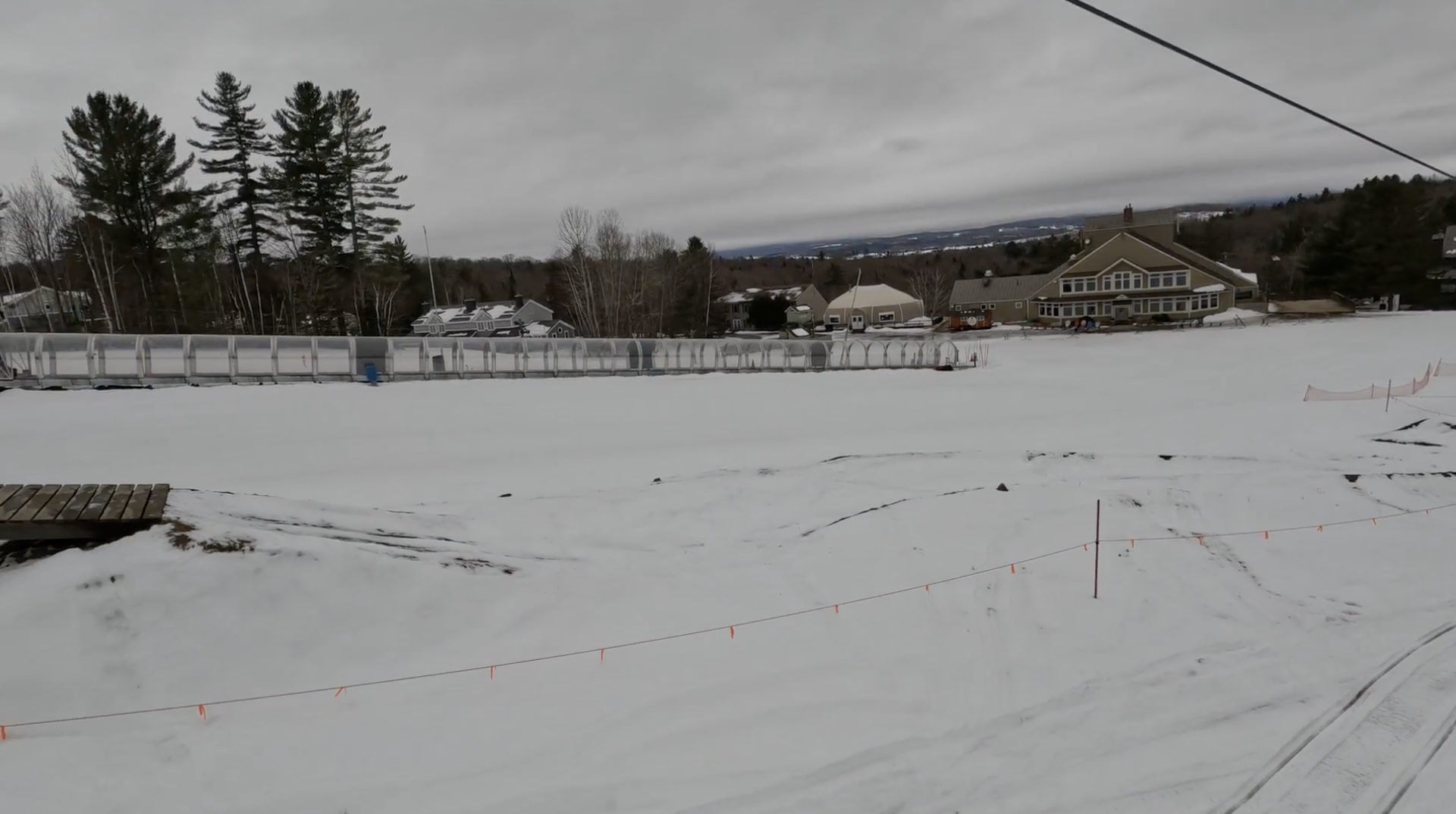 View of ski lodges and a covered tube at Burke ski resort, Vermont