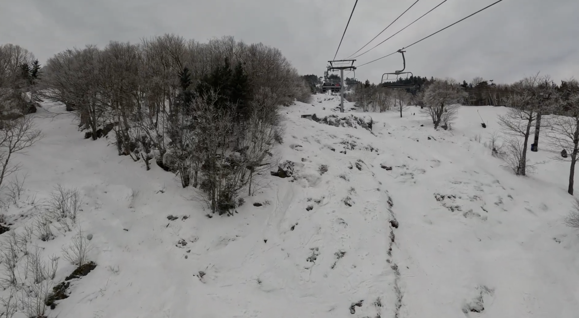 Riding up a ski lift on a cloudy day at Mont Orford, Quebec