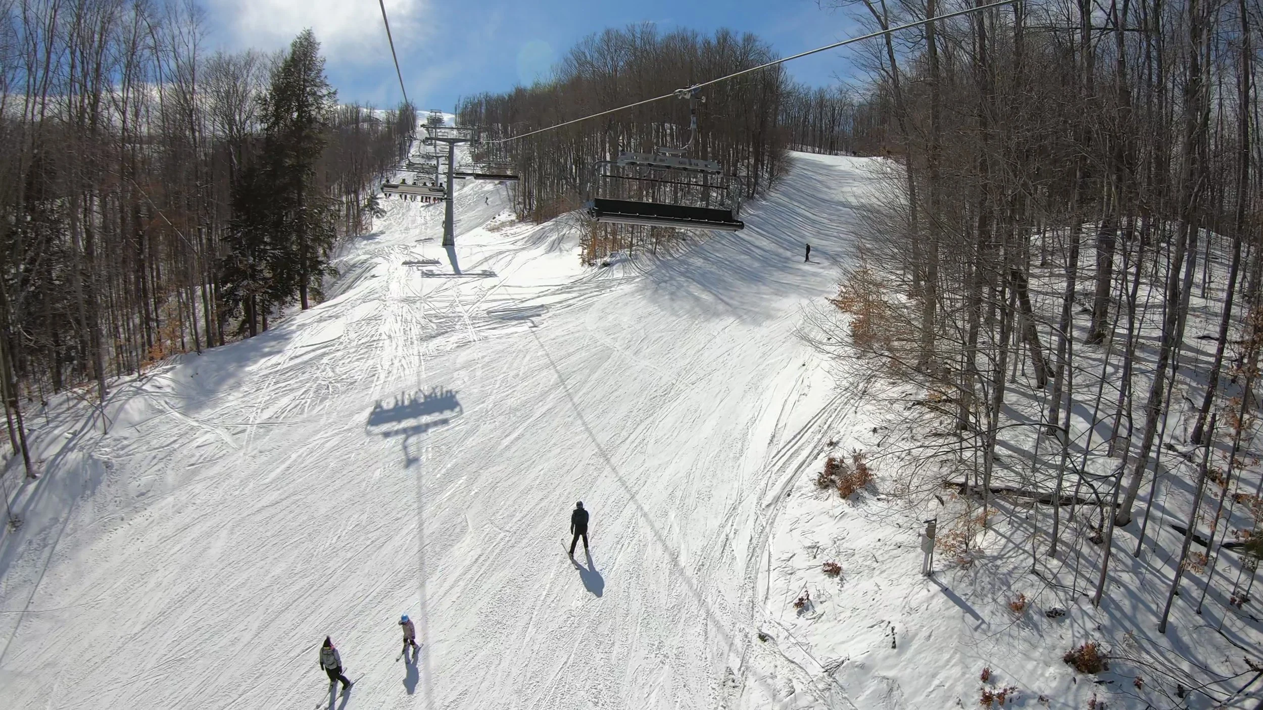 A ride up the Disciples 6 chairlift on a snowy day at Boyne Mountain ski resort.
