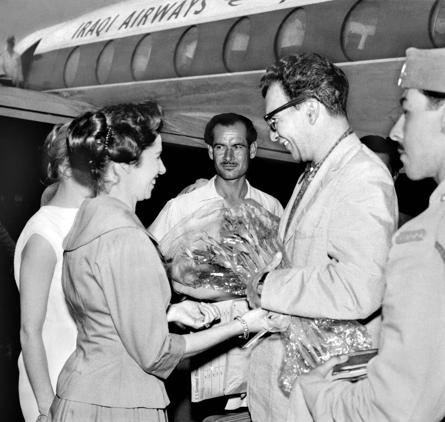 Dave Brubeck receives a bouquet upon arrival at the airport. Baghdad, Iraq, 1958. Courtesy of the Brubeck Collection, Holt-Atherton Special Collections, University of the Pacific Library. Copyright Dave Brubeck.