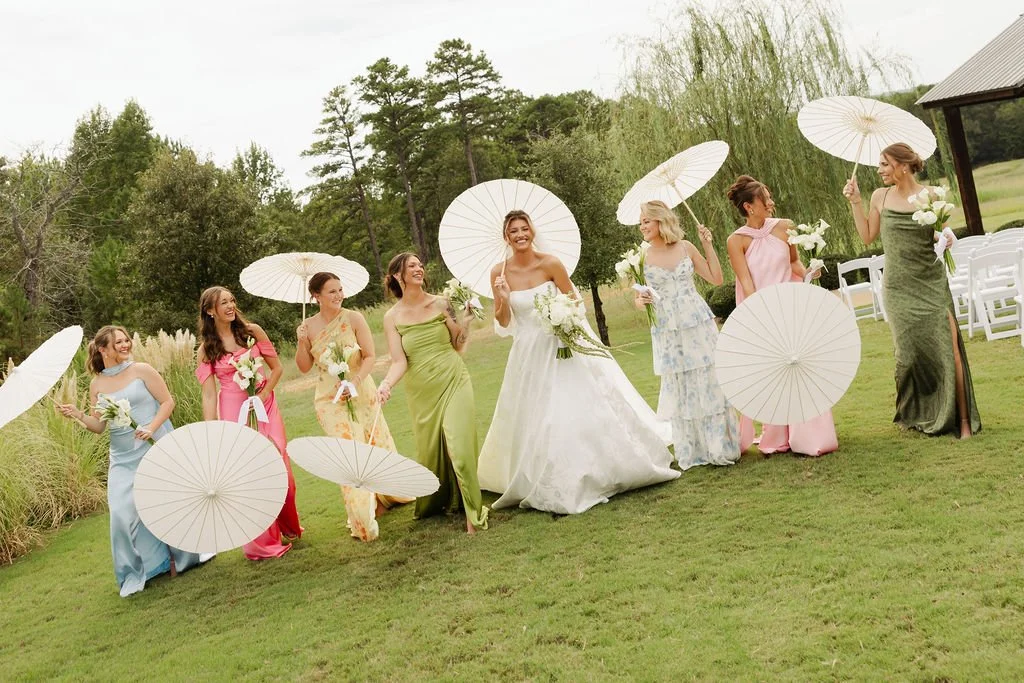 bridesmaids photos with parisols at sunset oaks venue