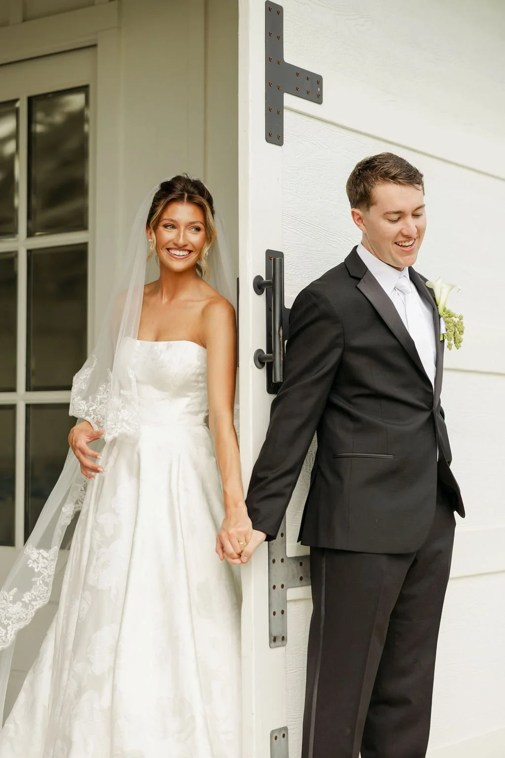 Bride and groom first touch at Sunset Oaks