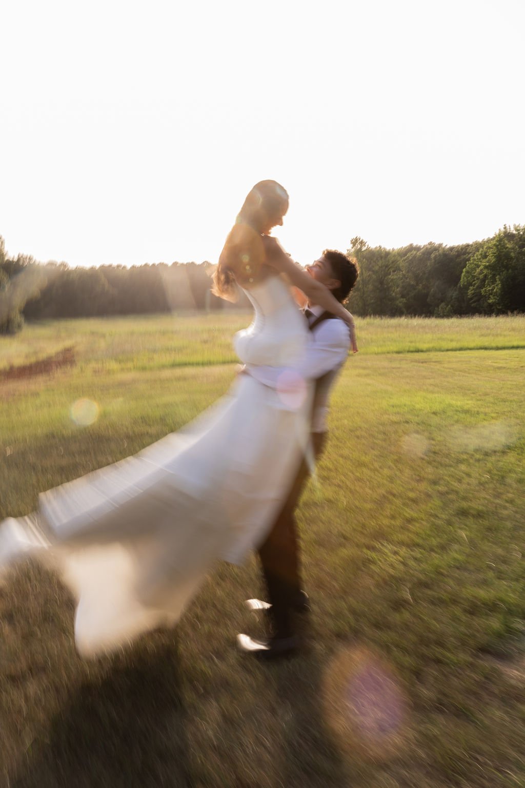bride and groom spinning at outdoor wedding in tyler texas