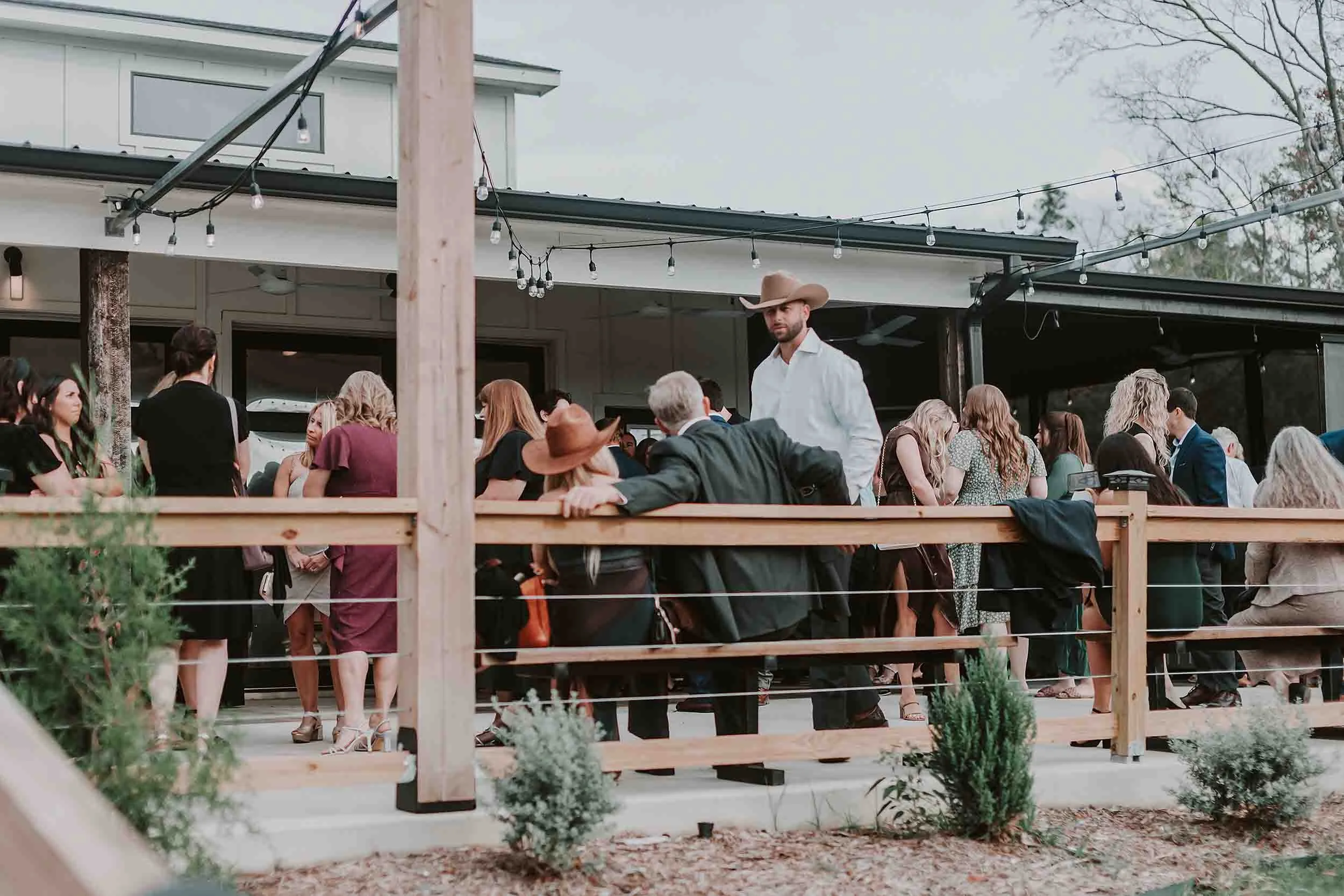 cocktail hour on the wrap around porch at sunset oaks