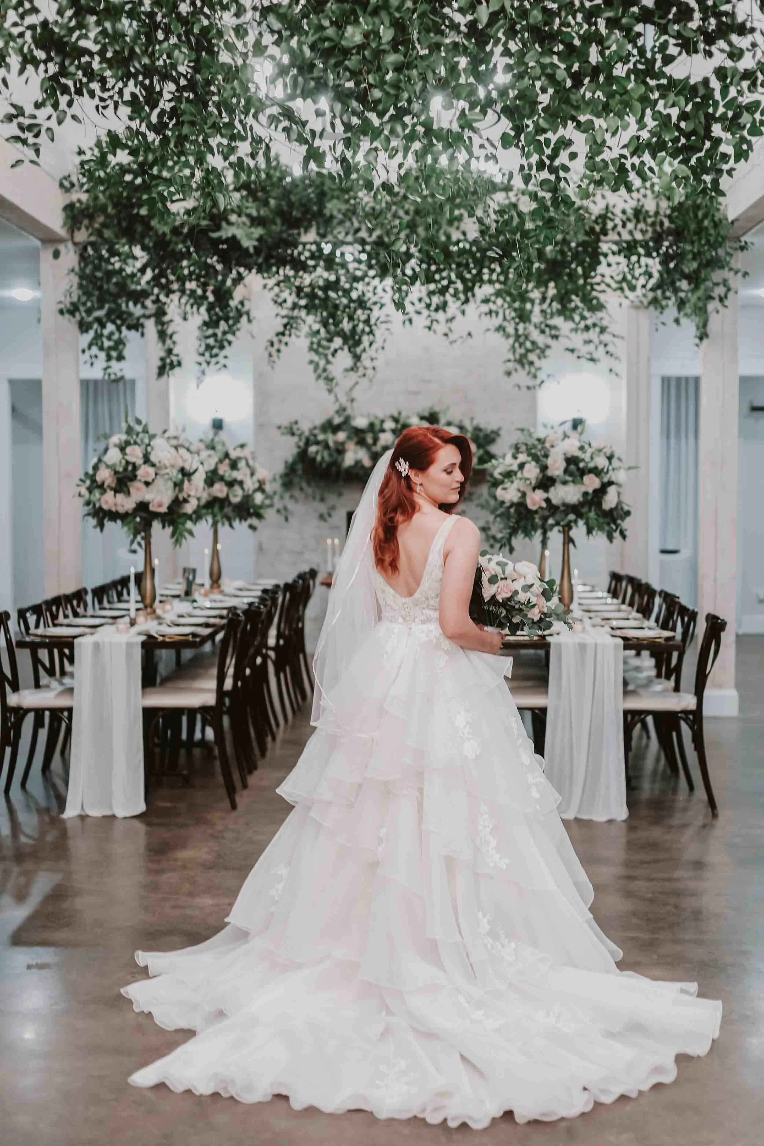 Bride in her wedding dress at sunset oaks