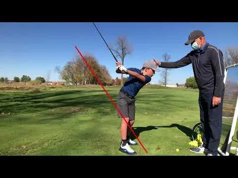 Don demonstrating the bottom of the golf swing