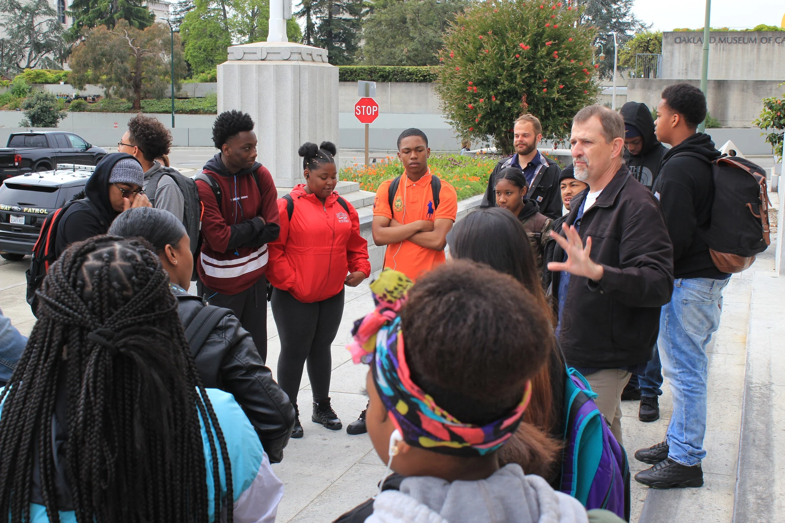 Teacher John Warren speaking to his students at the beginning of the project.