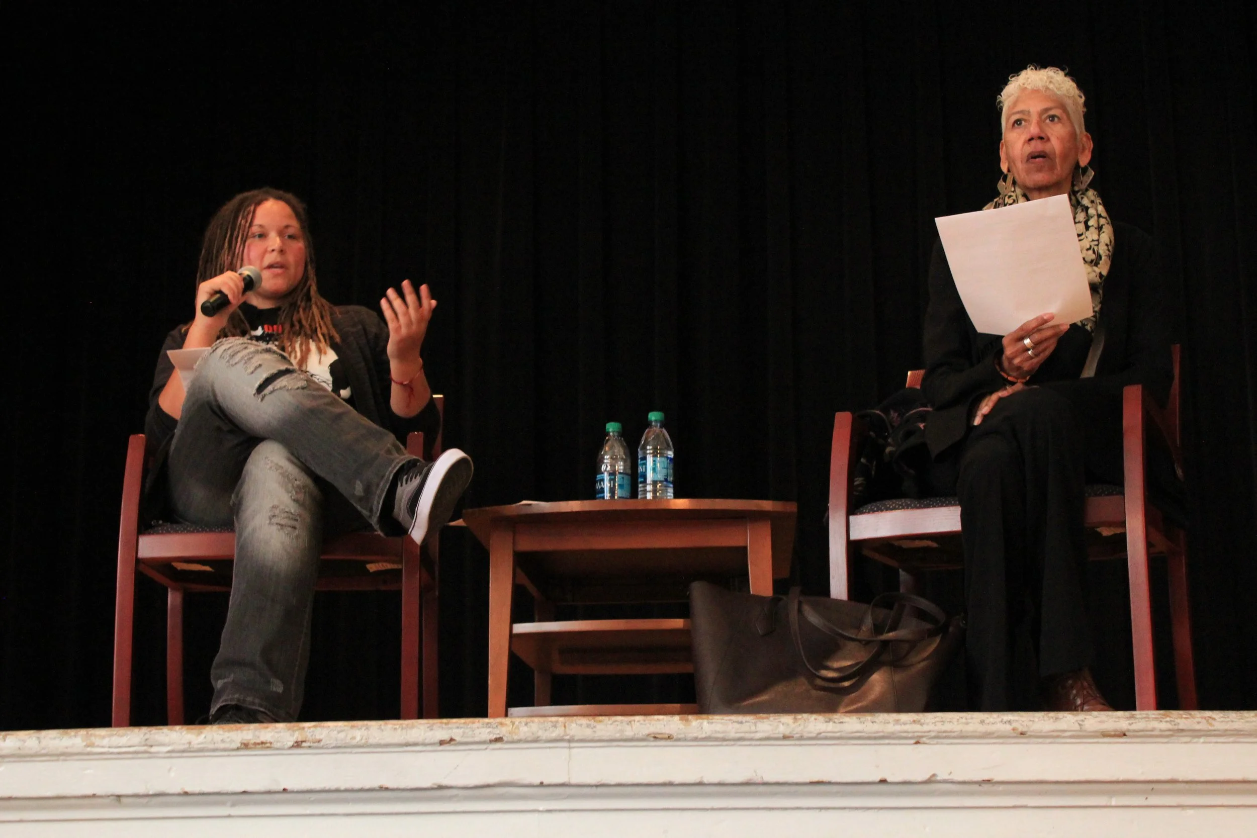 Community organizer Melissa Crosby and former-Black Panther Erica Huggins speak with students at Envision Academy. 