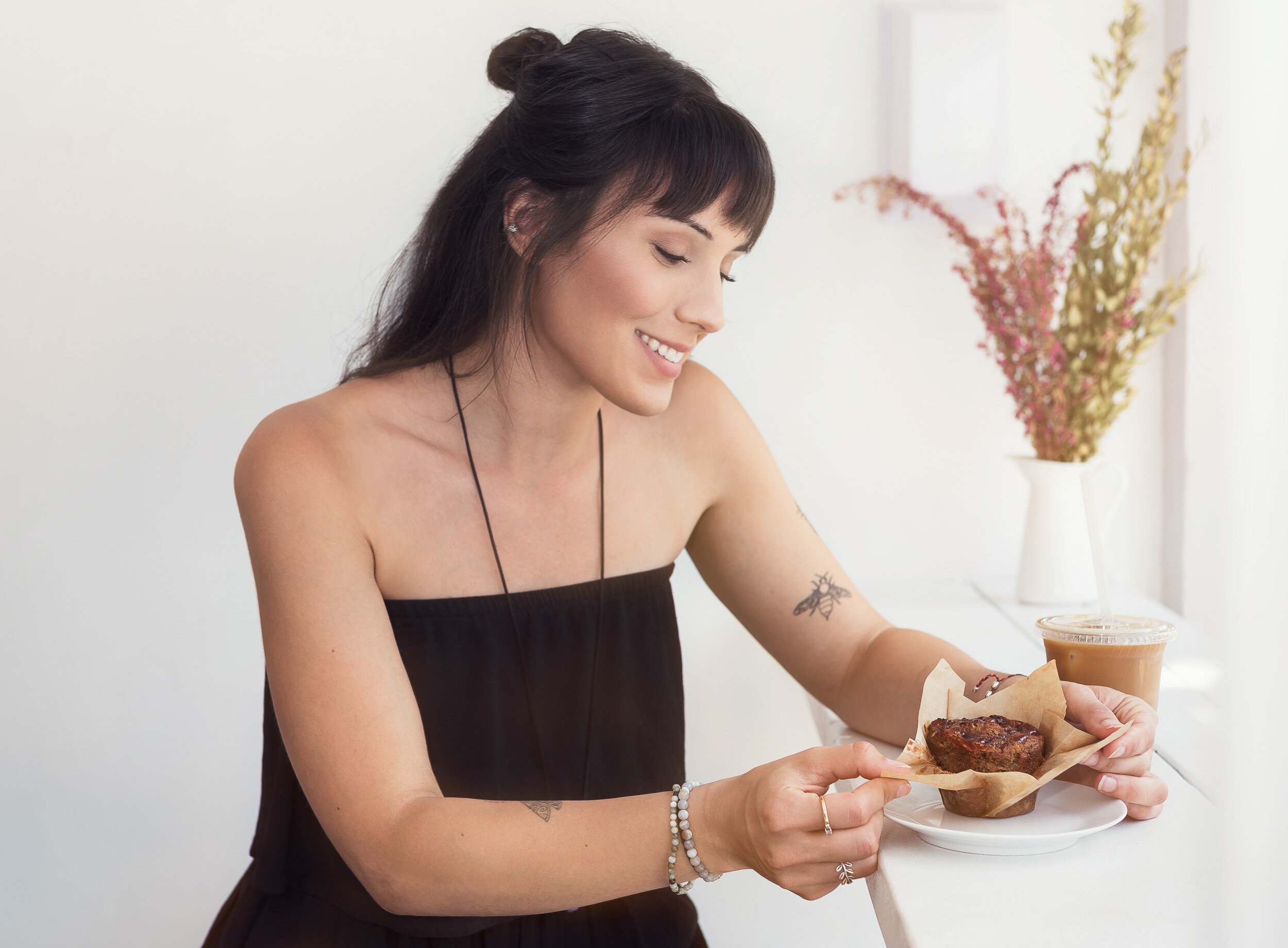 lifestyle-portrait-of-young-woman-eating-muffin-1.jpg