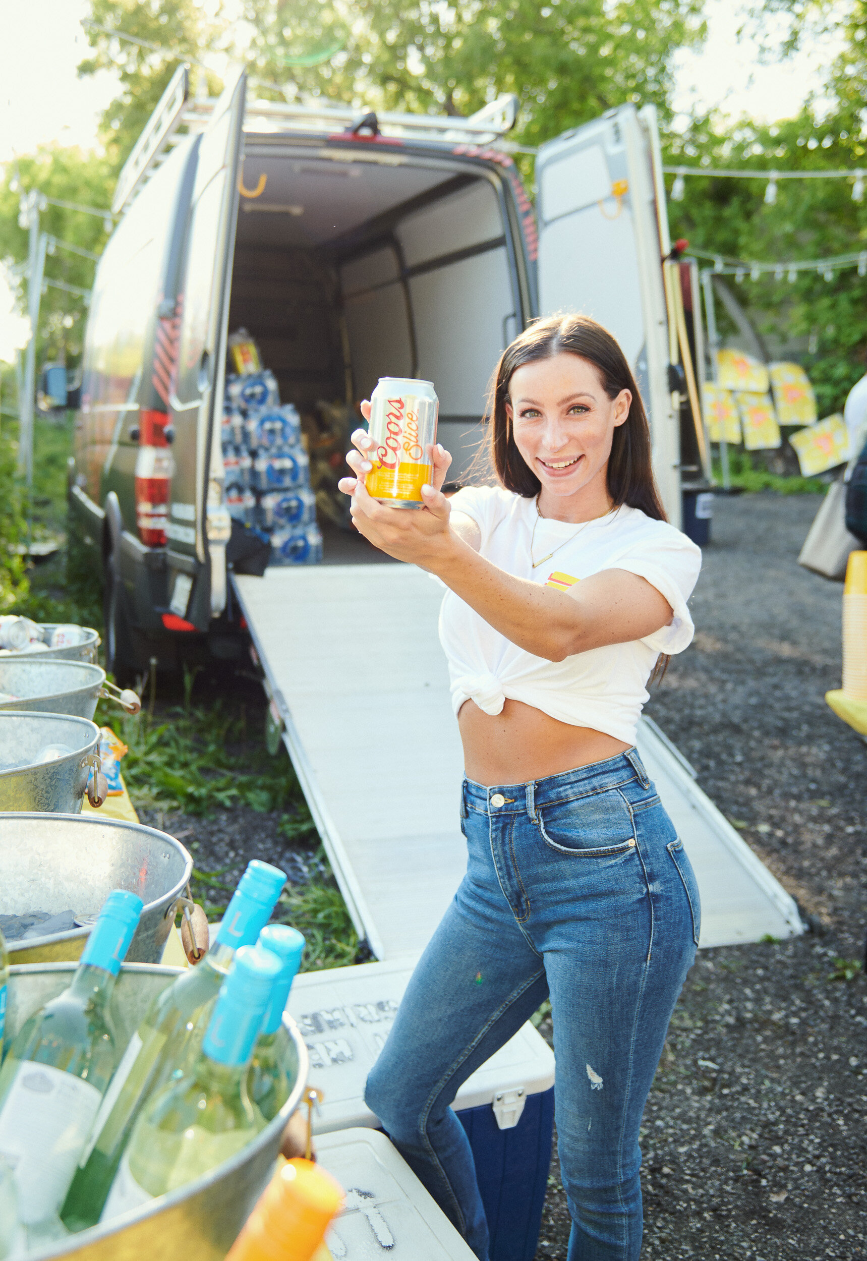 smiling-woman-holding-molsoncoors-beer.jpg