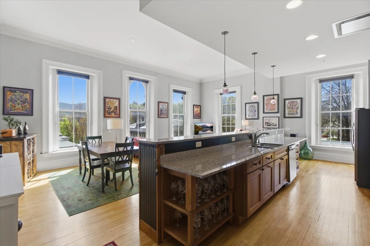Gorgeous, high-ceilinged downtown Bennington, VT condo for sale with grand living space, huge windows and lots of space for your favorite artwork.