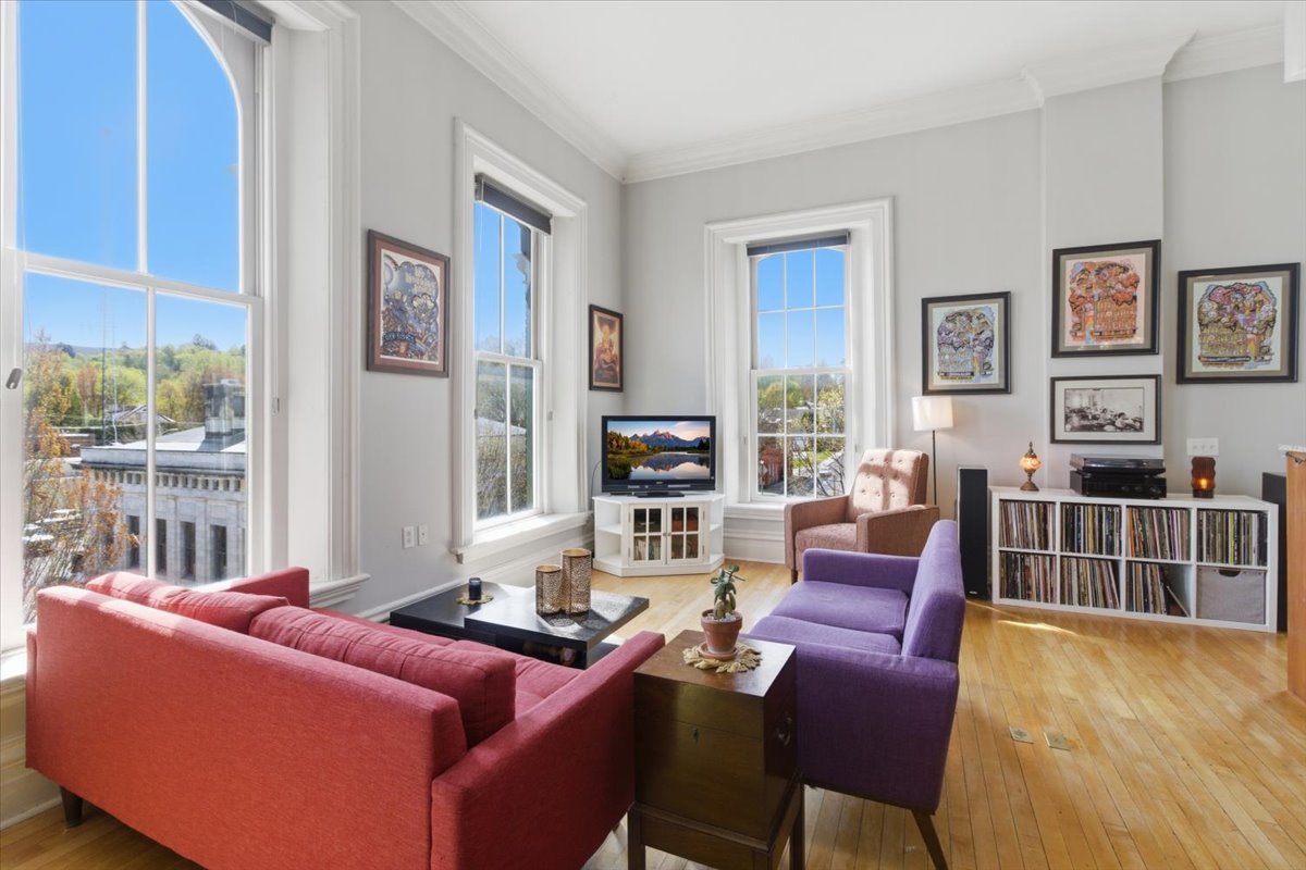 14' ceilings, huge windows with original 19th Century mouldings, original wood floors featured in a colorful downtown Bennington condo for sale.