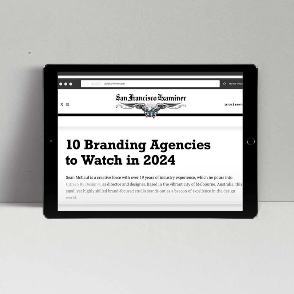 Tablet displaying a San Francisco Examiner webpage titled '10 Branding Agencies to Watch in 2024'.