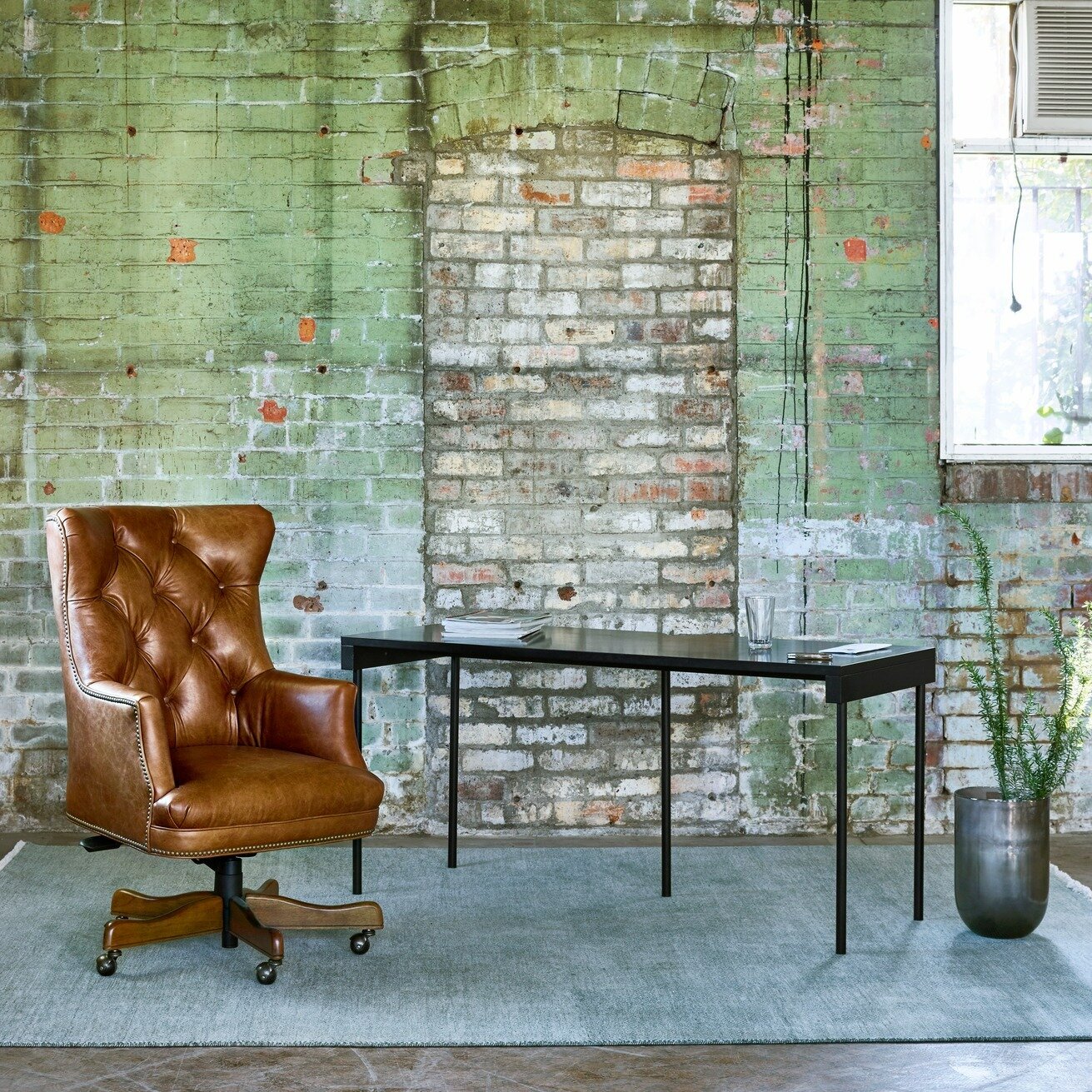 Warmth and Comfort | The Stewart Executive Chair's button-tufted back and gently scalloped wings create an elegantly contoured seat, poised atop a star base crafted from light walnut timber.⁠ 

#homeoffice #authenticleather #leatherchairs #hbandco #f