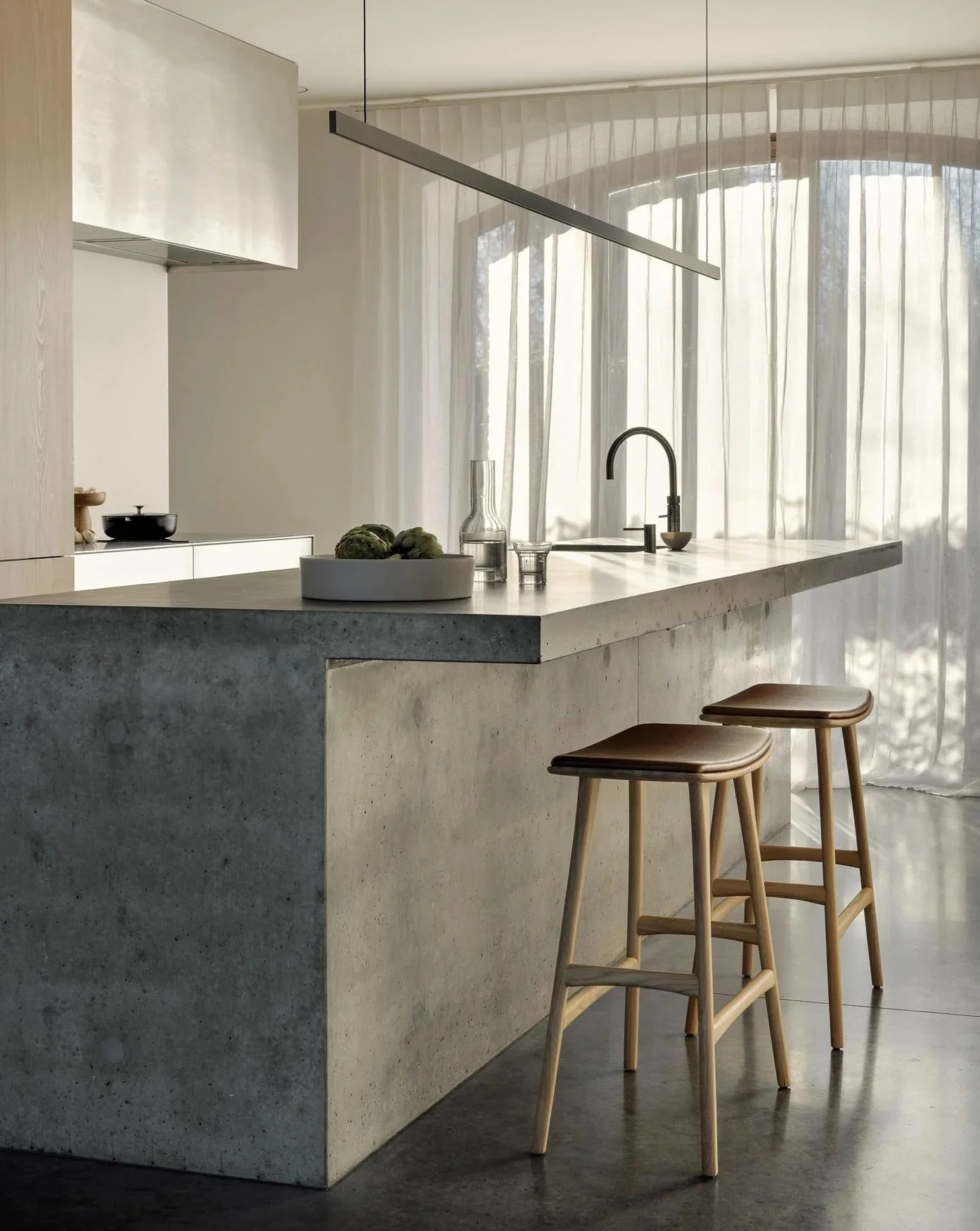 Minimalist kitchen with 2 stools.