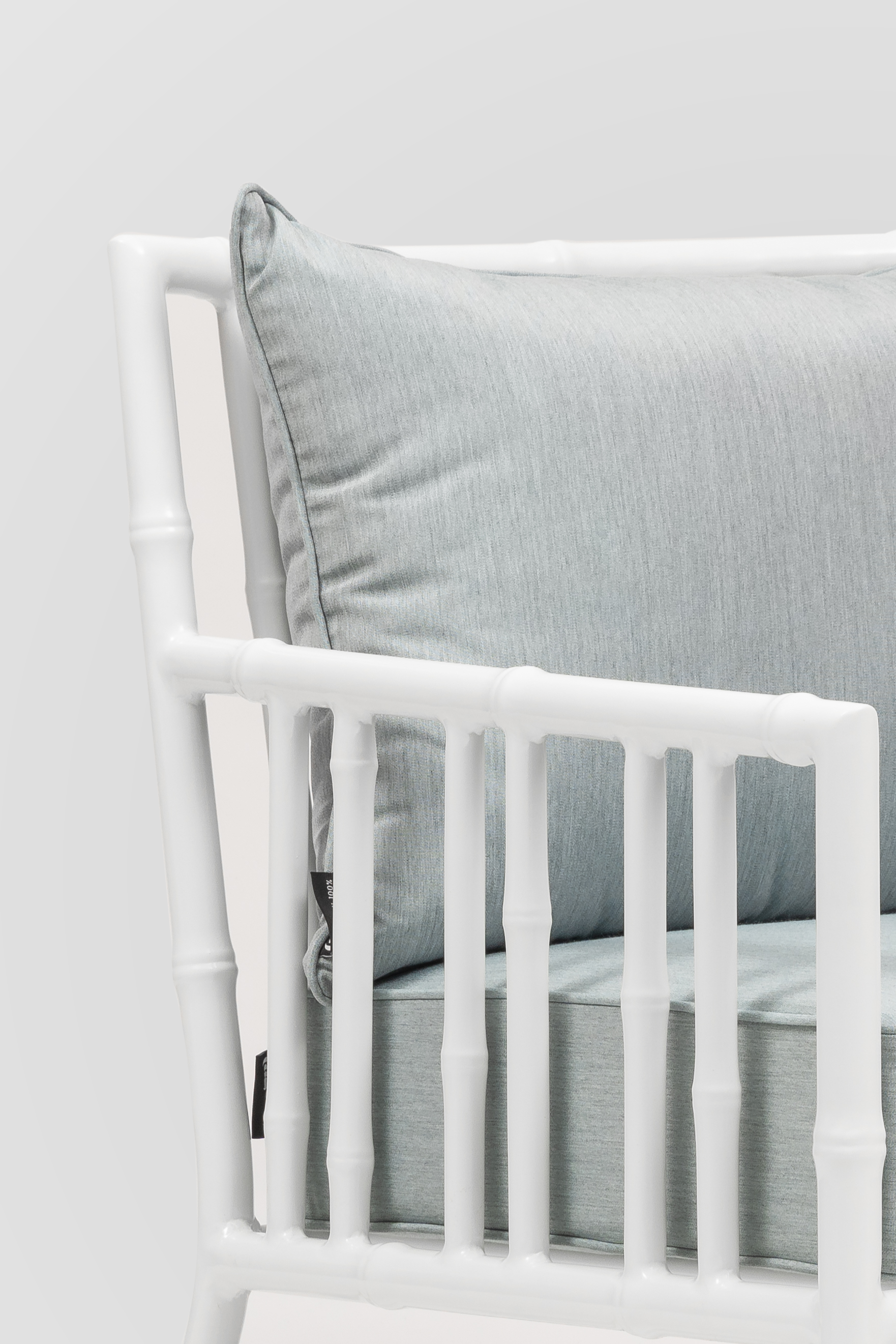 White frame outdoor seating with cushions