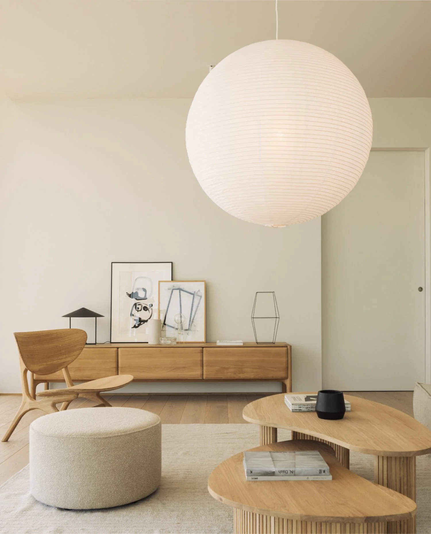 Living area with soft colours, natural woods and rounded shapes.