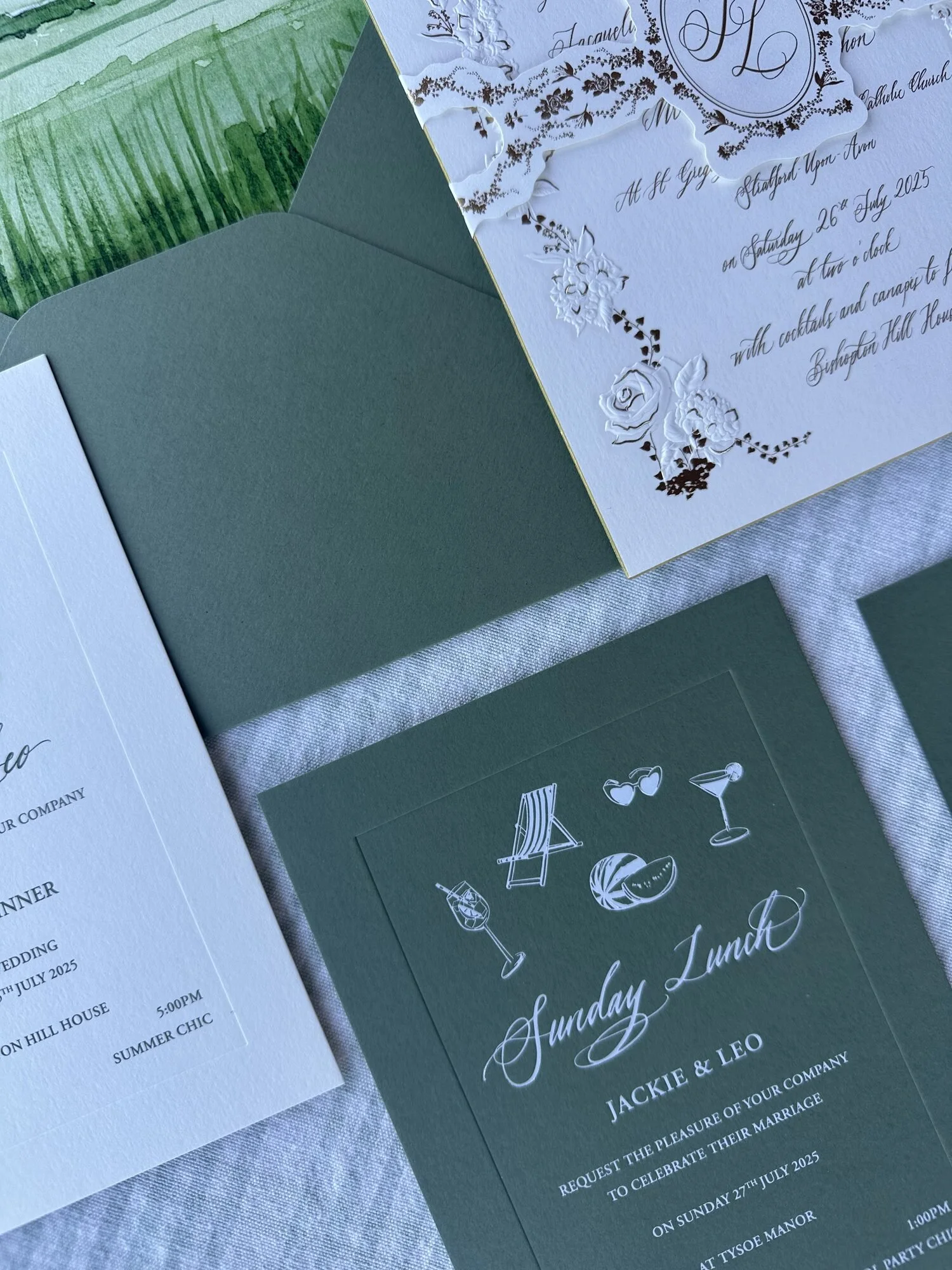 bespoke-wedding-suite-flat-lay-green-envelopes-gold-foil.jpg