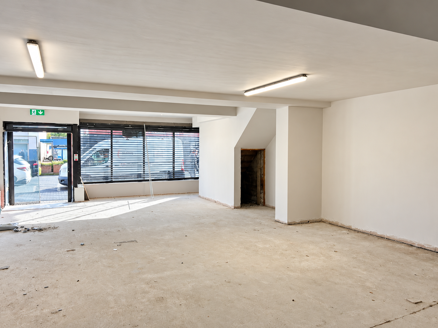 Bright Empty Retail Storefront Interior.png