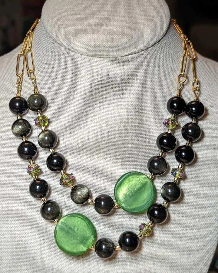 Check out this gorgeous piece by our customer @kelleymc40 

She paired some of our wedding cake beads &amp; bright green glass coins, with some obsidian globes and gold chain and the completed piece is just absolutely stunning!

Thank you for sharing