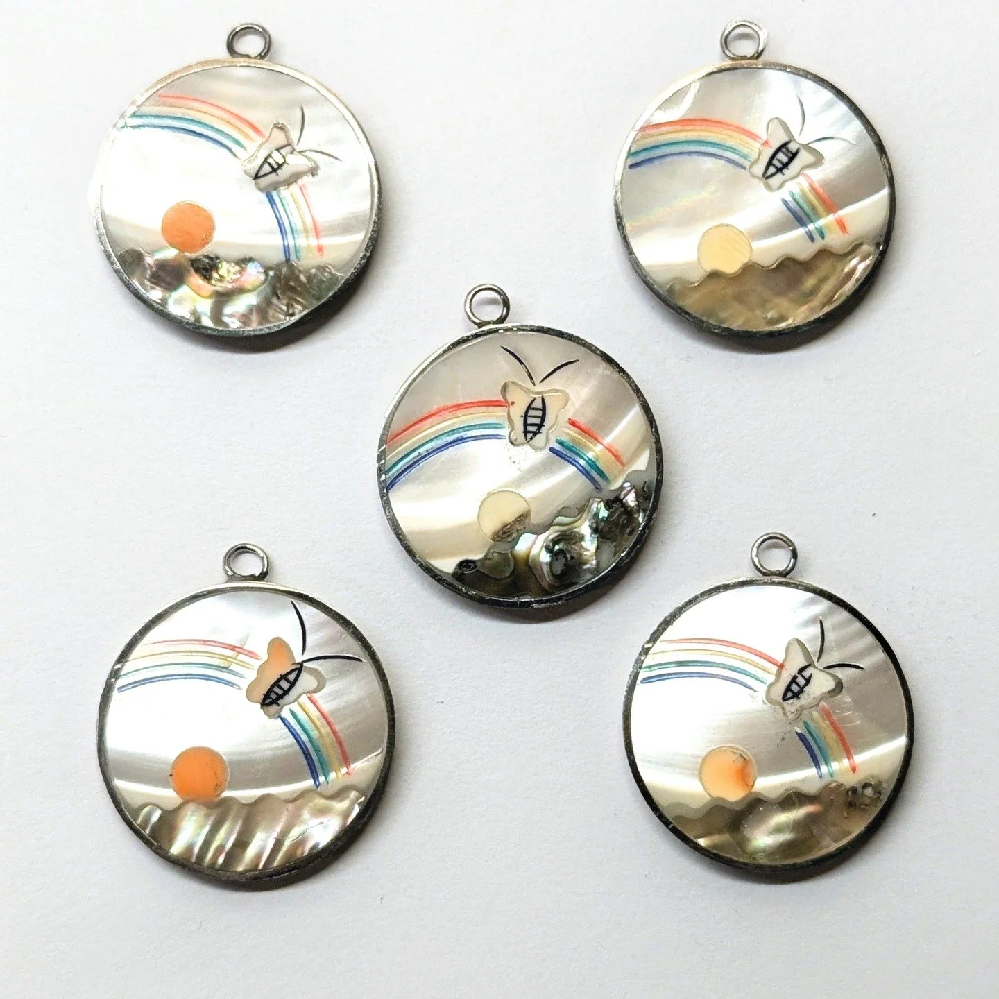 These delightful Picture Pendants from the 1970s are now avaible on Etsy and the HeyBeads Website

https://heybeads.etsy.com/listing/4397112294/1970s-rainbow-butterfly-abalone-mother