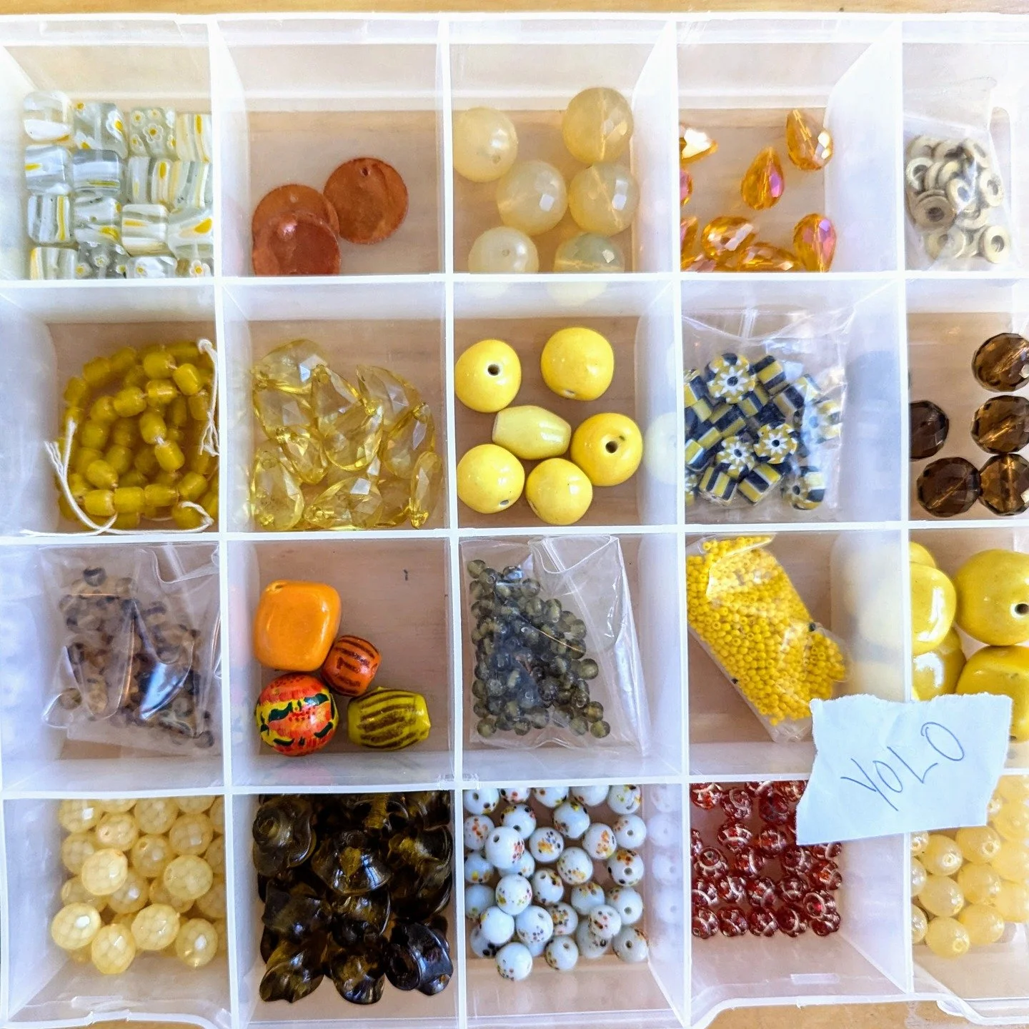 You Only Live Once... so bead like it!

This one-of-a-kind collection is packed into a durable art container (11 x 8 x 2") with fixed compartments and a removable lid (broken hinges = bonus). Flip the lid upside down for a secure workspace. Ever