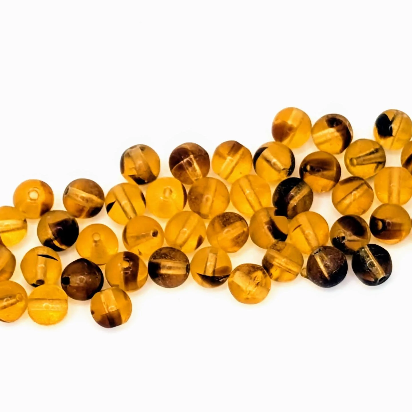 These tiny vintage glass globe spacers just hit both the Etsy store and the website. 

1960s molded glass brown on tan. Each one is a little different. There are more than 60 pieces in each order, packed into a reusable screw top acrylic canister.

H