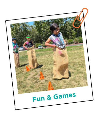 Three kids doing a potato sack race