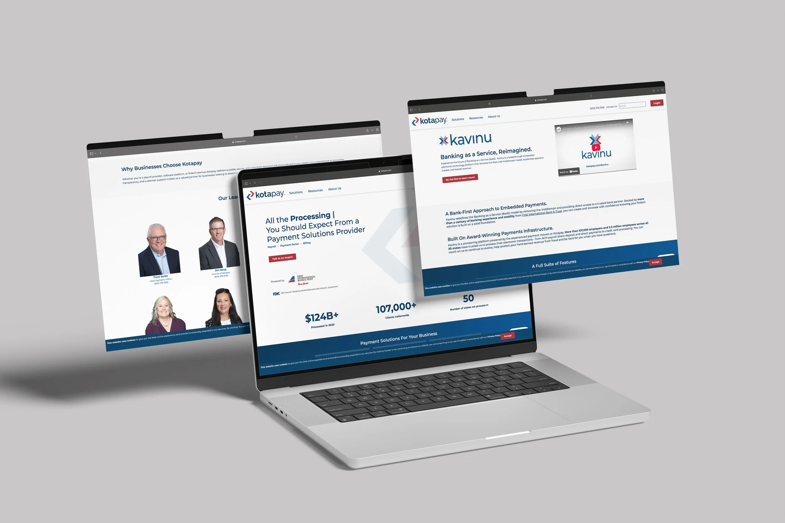 Multiple computer screens display the homepage of a payment solutions website called Kotapay, with text about processing payments, client information, and features.