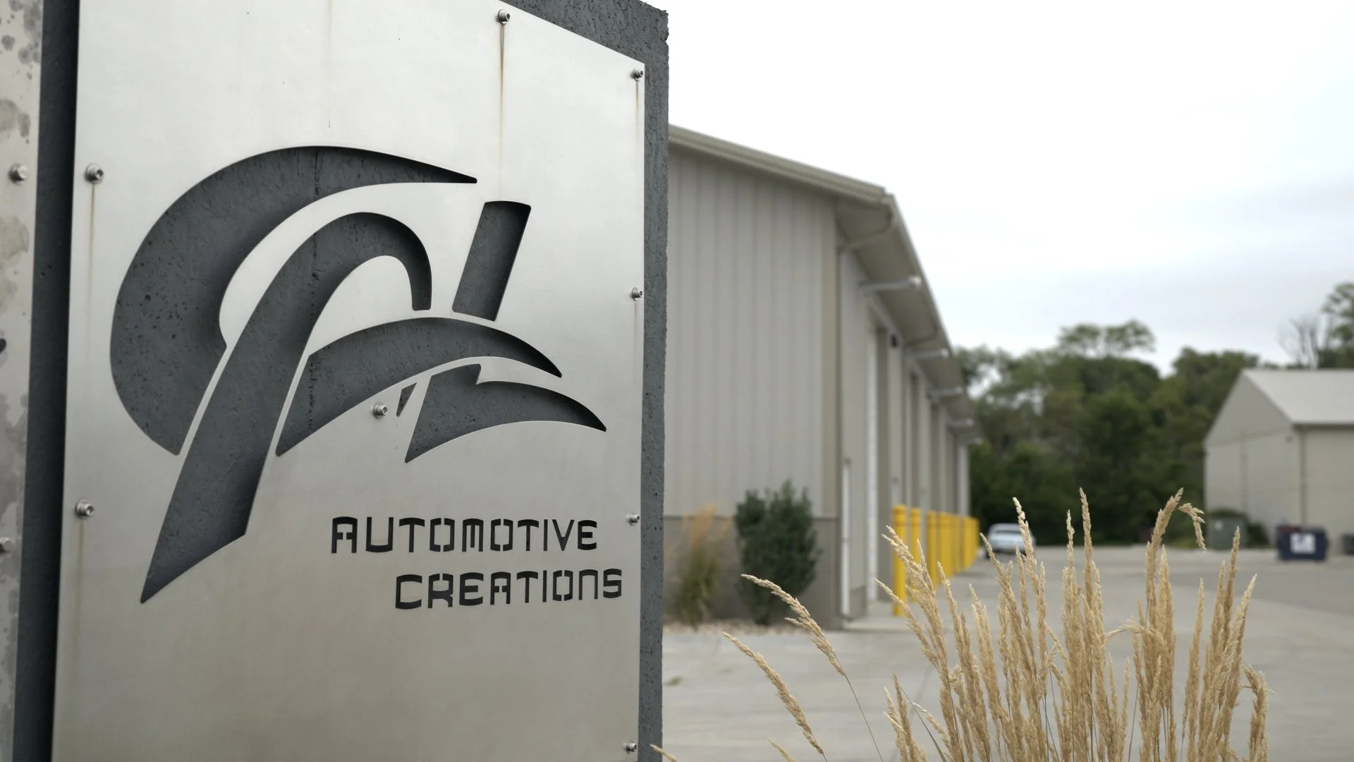 CAL Auto Creations automotive workshop exterior in Nebraska during filming of the Barrett-Jackson Cup documentary series