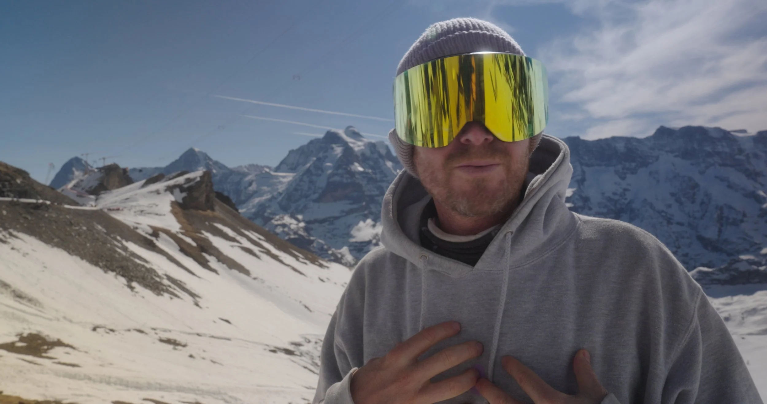 Snowboard athlete discussing mindset and progression during Swatch Nines event in Switzerland, filmed as part of a freeski and snowboard documentary production.