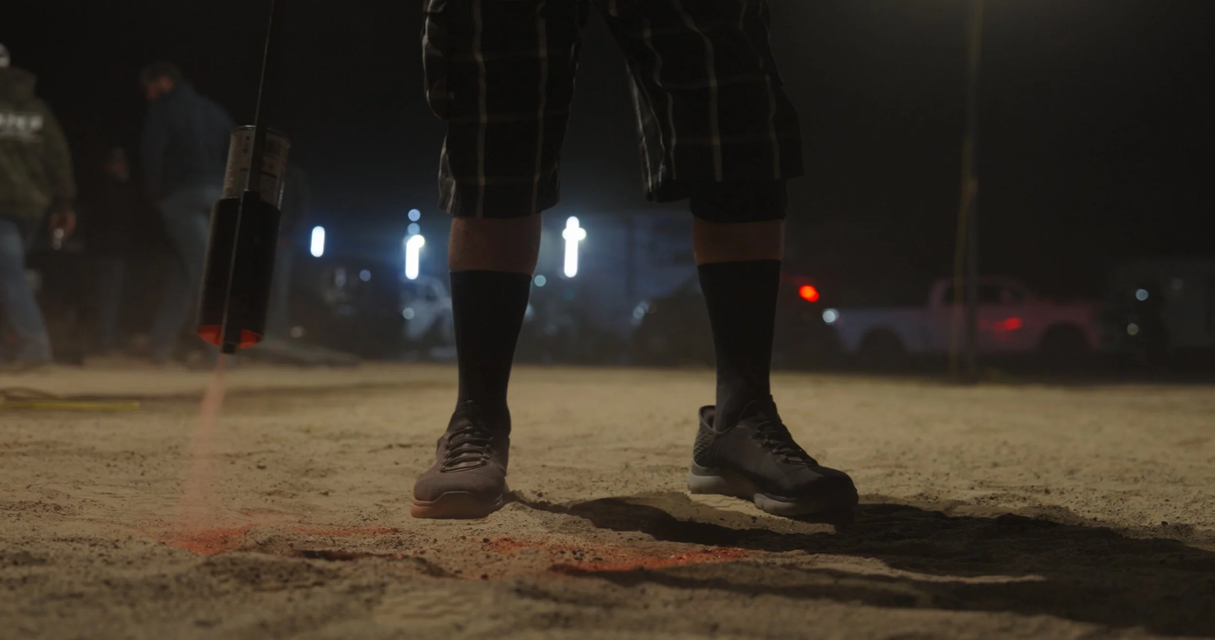 Candid nighttime desert scene showing a person standing in the sand during the trip.