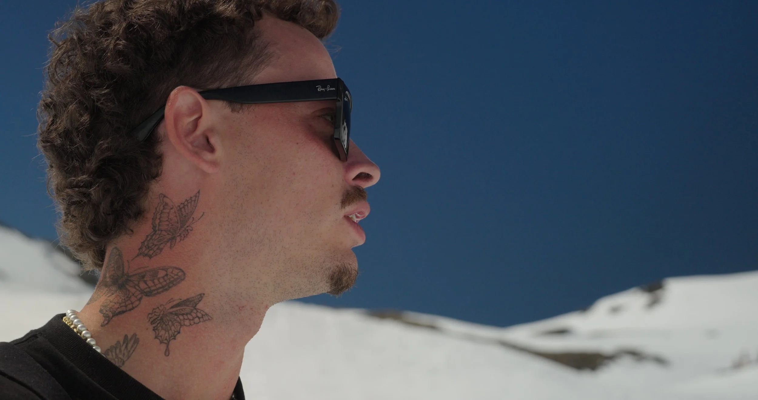 Freeski athlete profile shot during Swatch Nines event in Switzerland, filmed with documentary-style sports cinematography.