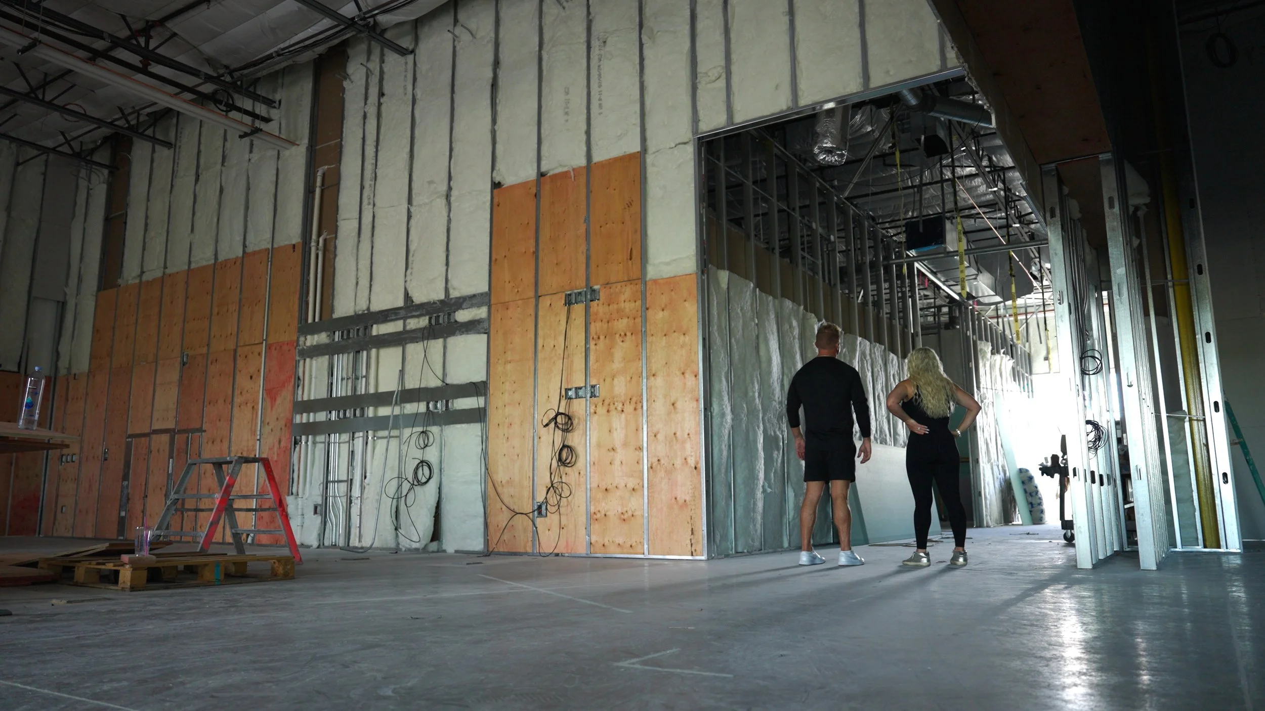 Empty concrete shell of the Hive Fit Club gym in Scottsdale before construction, filmed by Ragtown Media as the opening of a branded documentary.