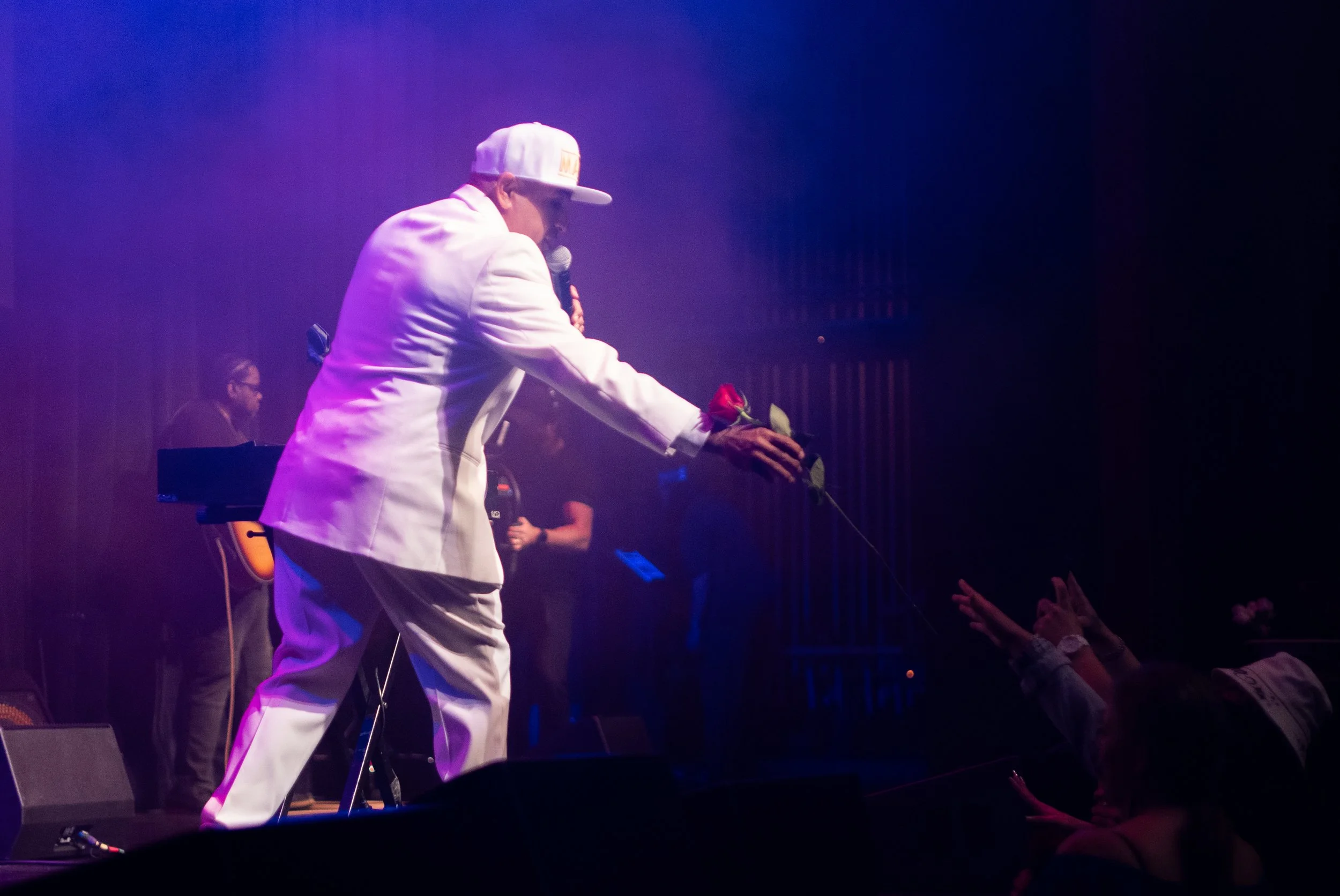 MC Magic interacting with fans on stage during the 30 Years of Magic live performance at the Orpheum Theatre