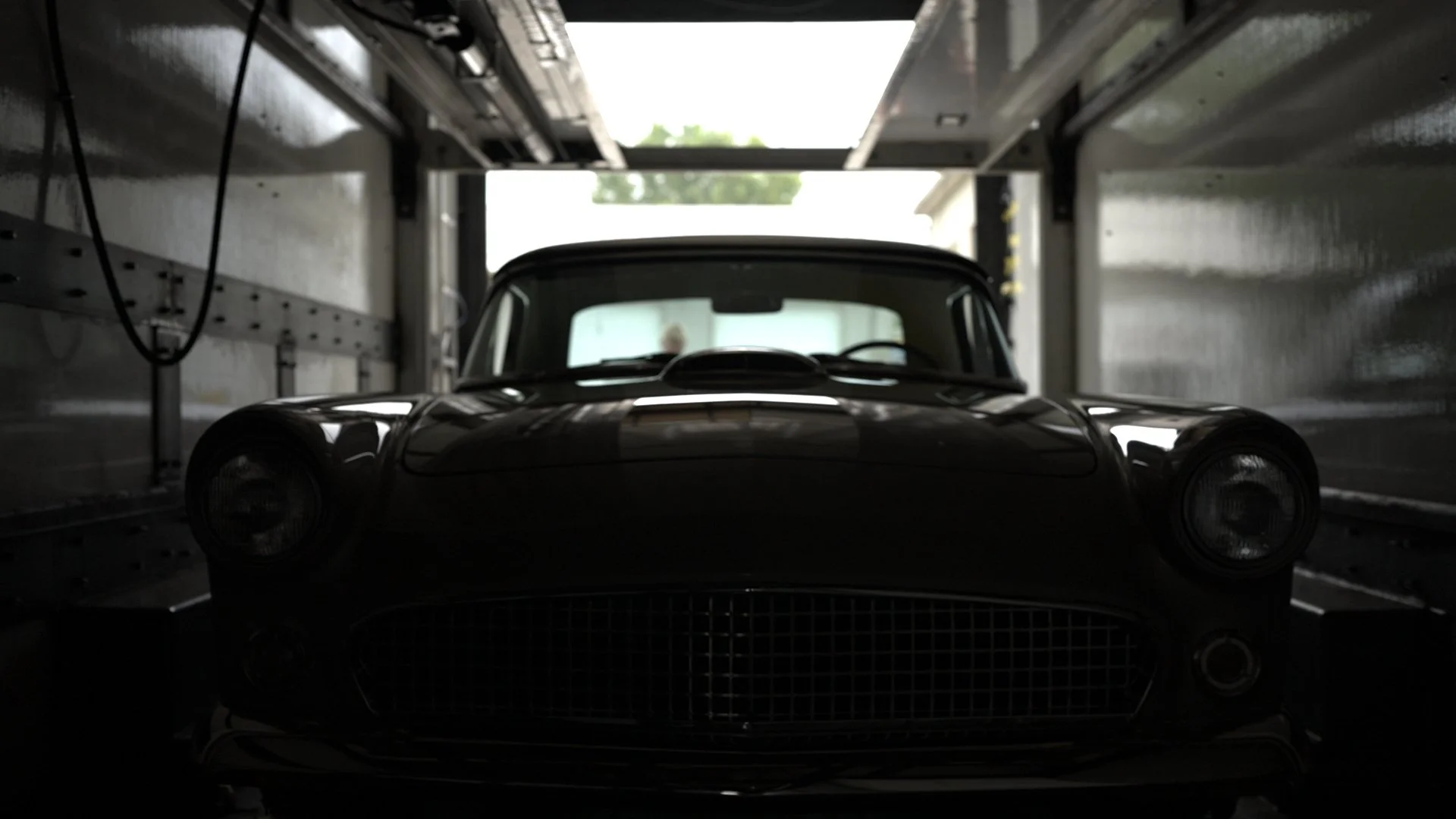 Custom-built classic car silhouette inside CAL Auto Creations trailer ahead of Barrett-Jackson Cup auction in Scottsdale.