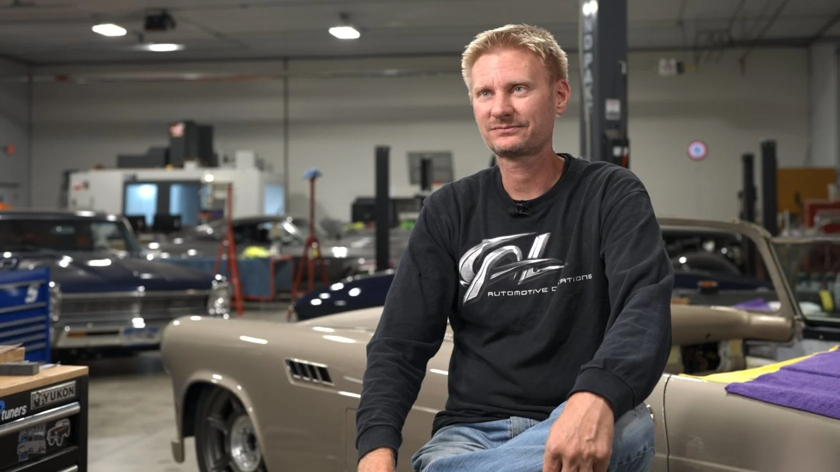Lead builder Andy Leach at CAL Auto Creations interviewed inside their custom car shop for the Barrett-Jackson documentary series.