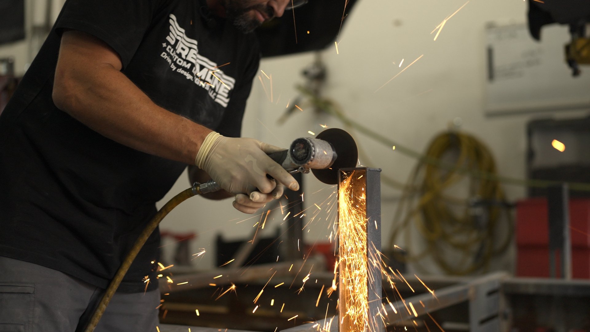 Metal grinding and fabrication work at Streamline performance shop preparing custom vehicle for Barrett-Jackson Cup