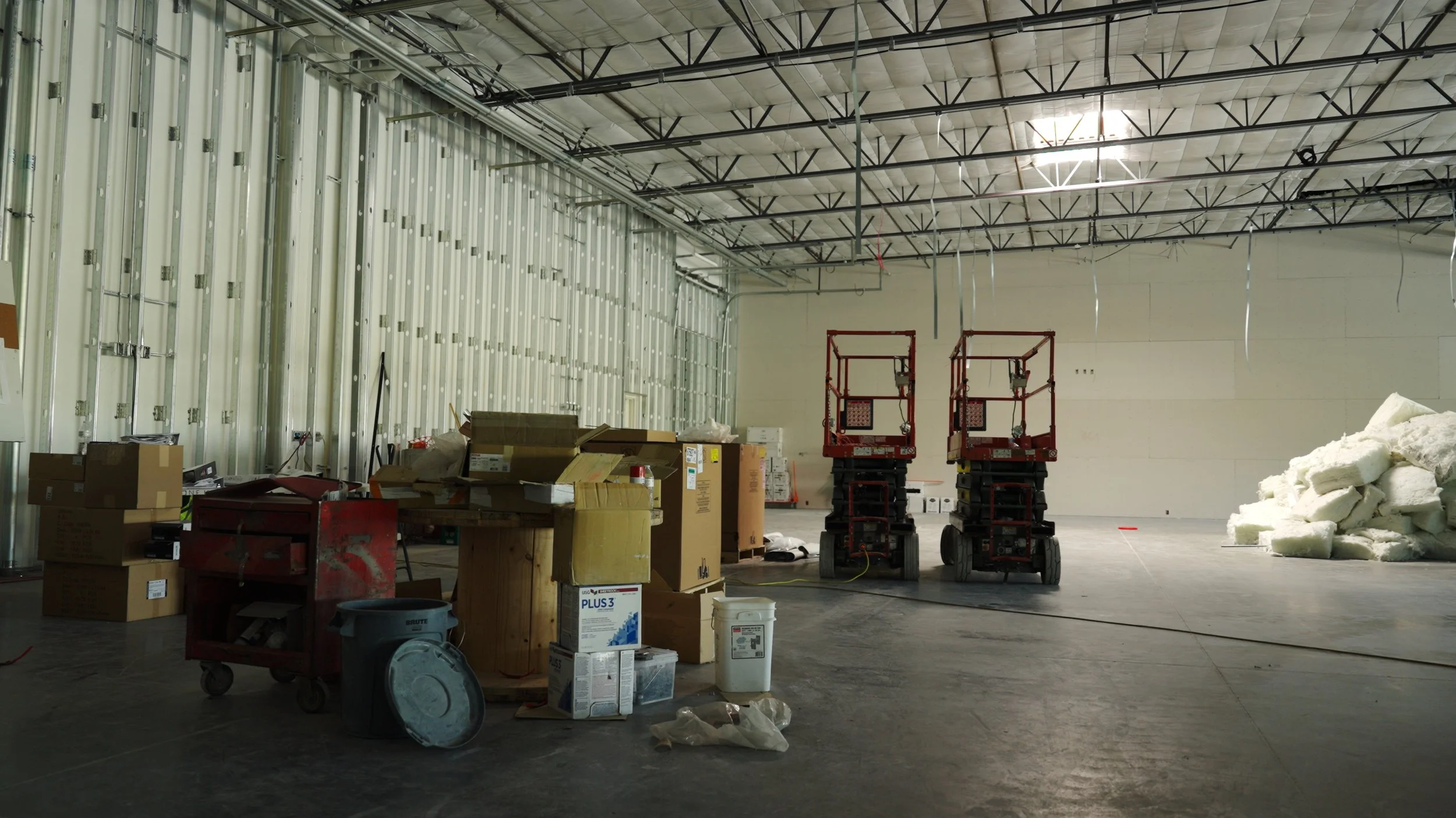 Large open gym space under construction at Hive Fit Club during the development of the Scottsdale fitness facility.