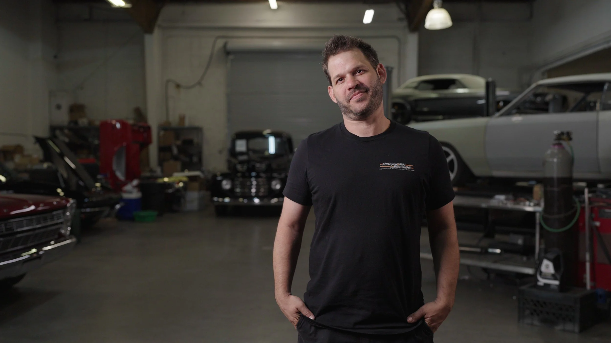 All American Hot Rods team reviewing build plans and fabrication strategy in Phoenix shop ahead of Barrett-Jackson Cup