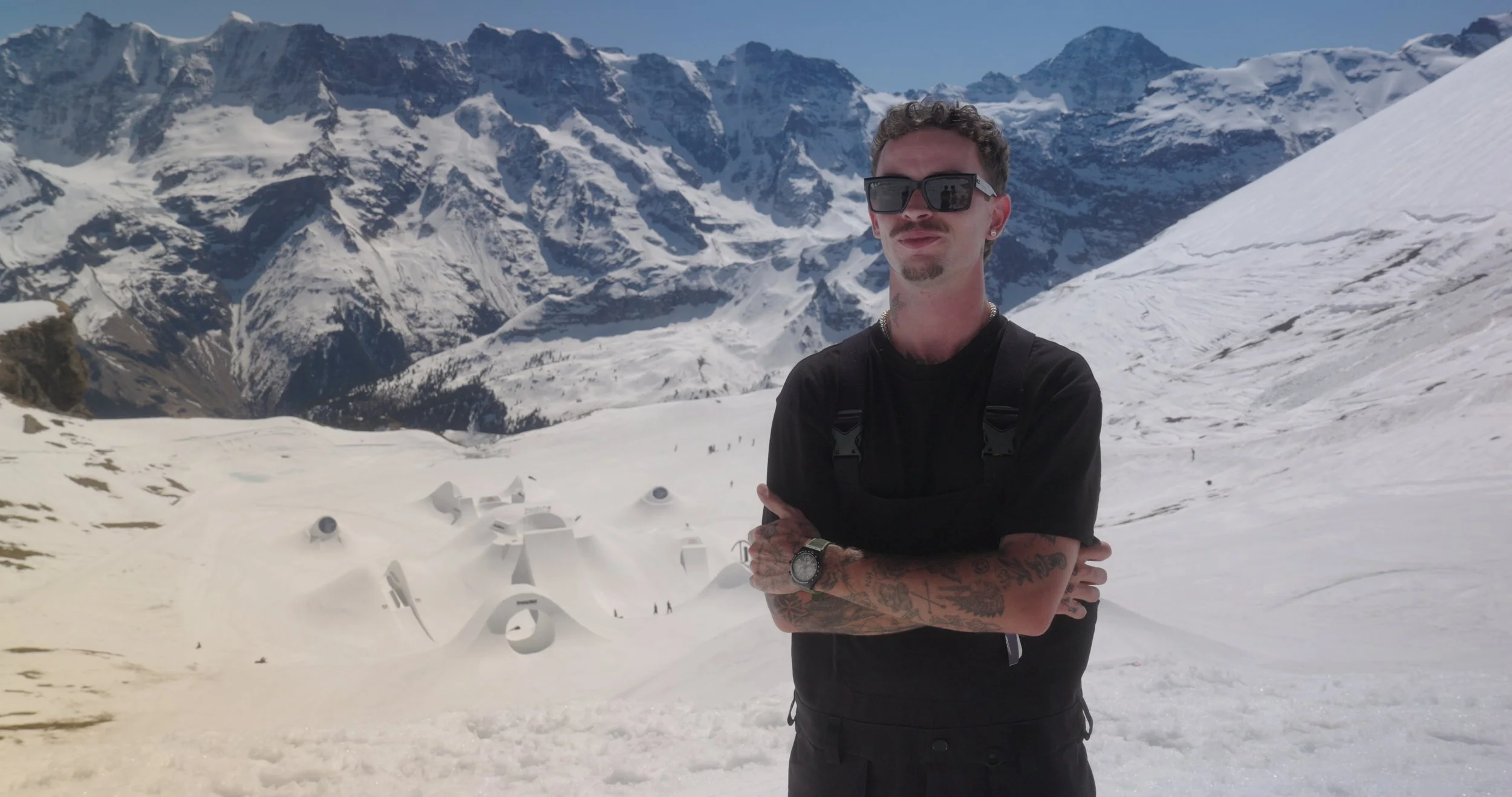 Professional skateboarder interviews about massive snow features at Swatch Nines, captured for action sports documentary production.