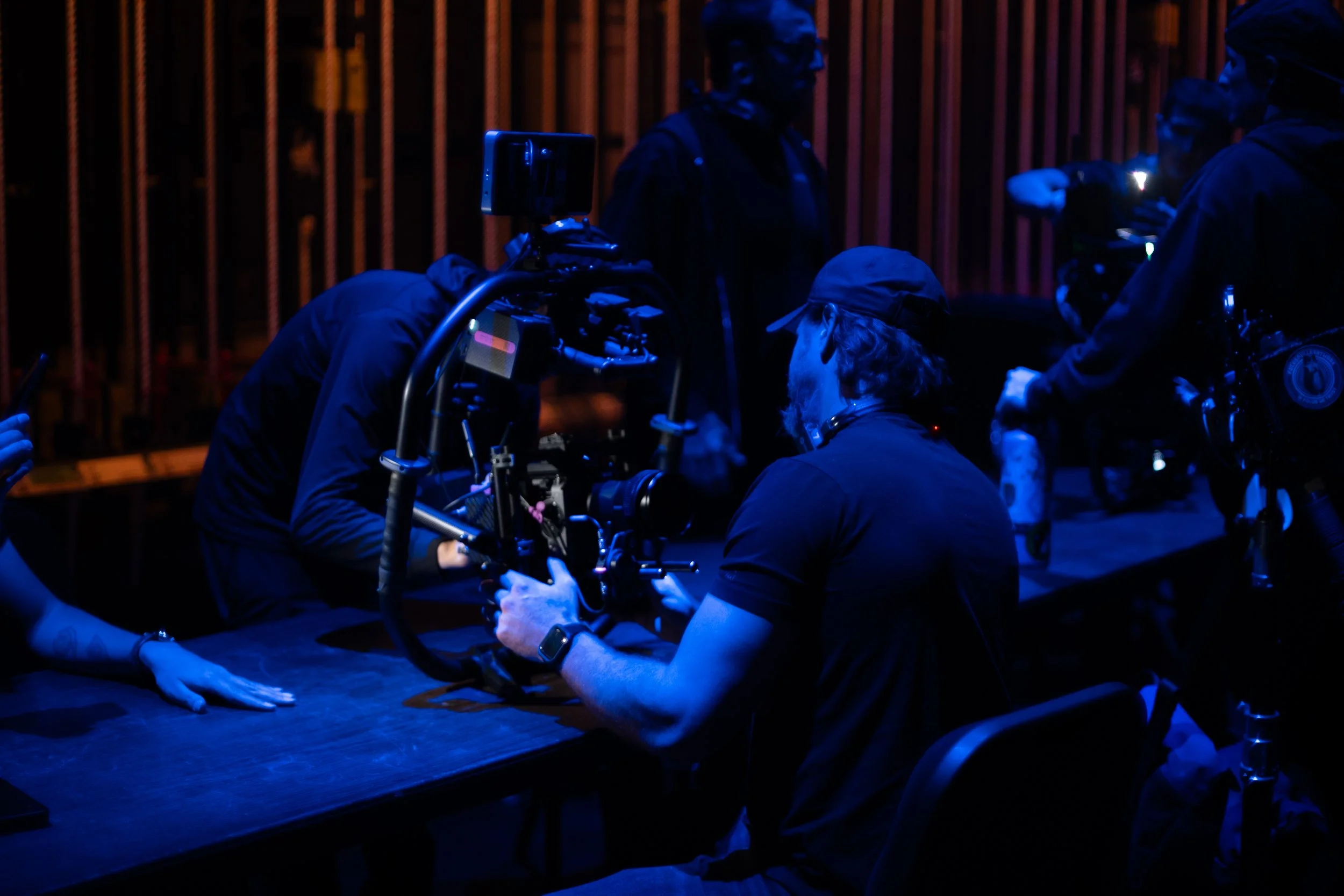 Behind-the-scenes live event production crew coordinating multi-camera coverage during the MC Magic performance at the Orpheum Theatre