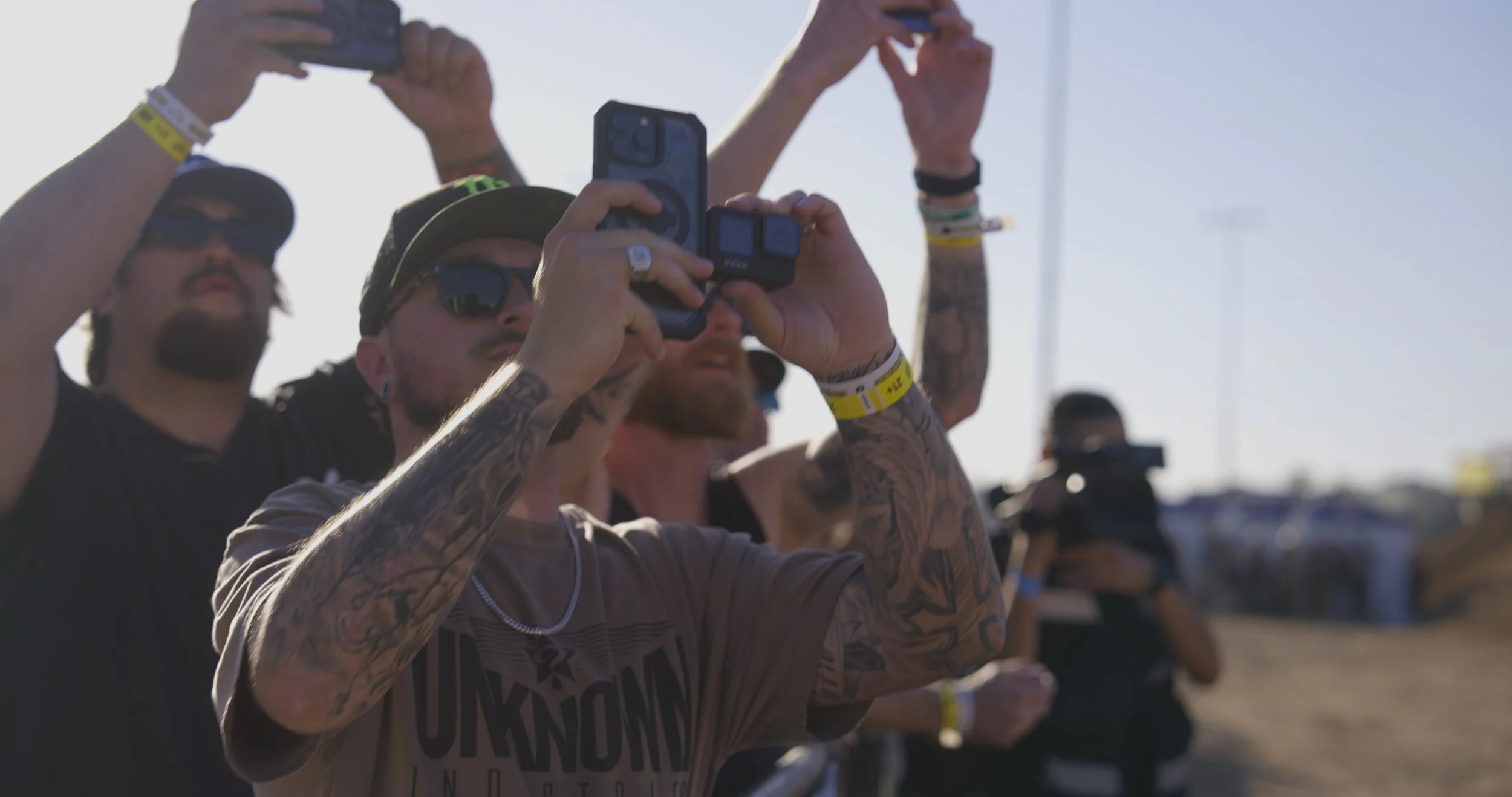 Fans filming stunt performance during Record Breakers extreme sports event in Mesa Arizona