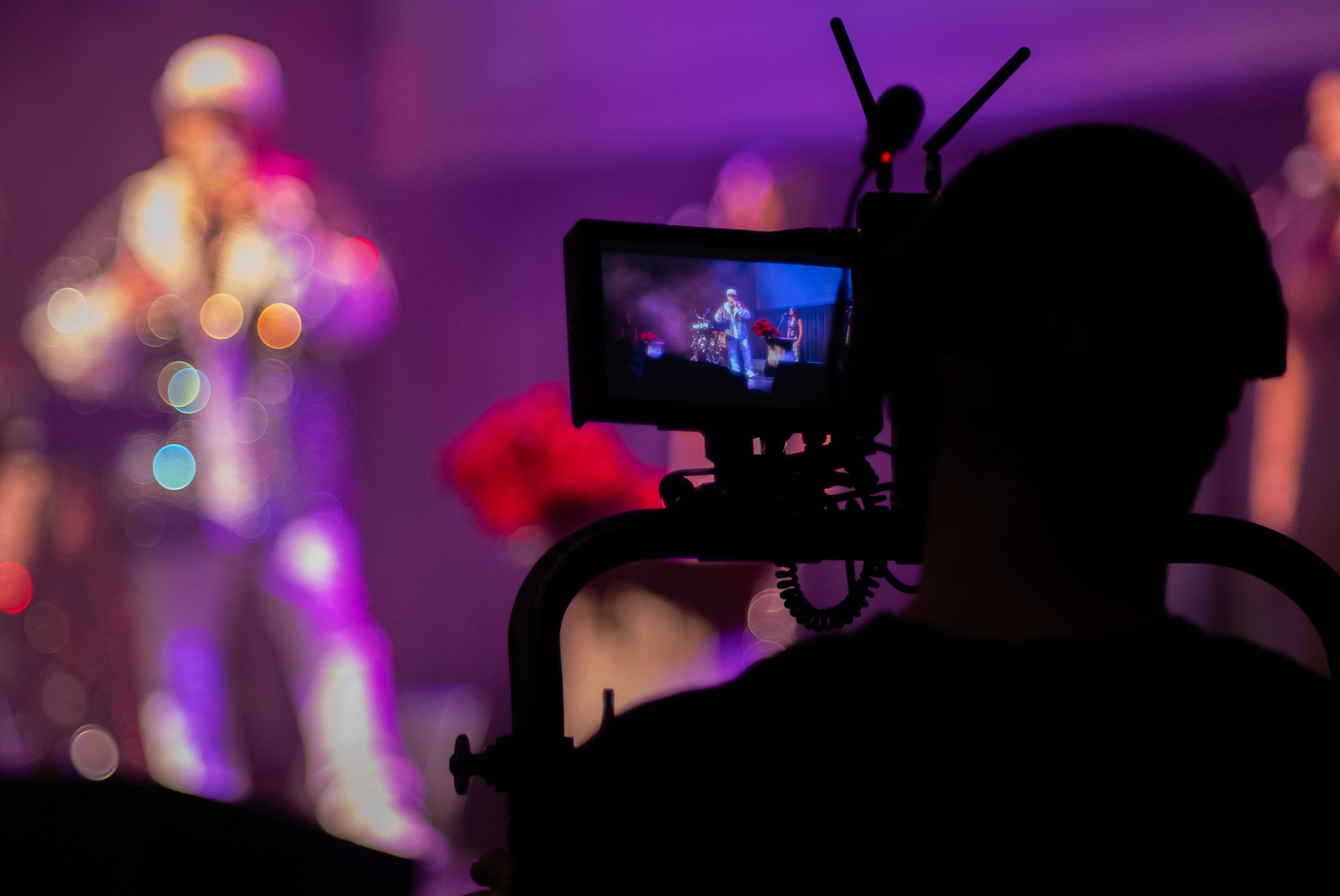 Cinema camera monitor capturing MC Magic’s live performance during the 30 Years of Magic concert