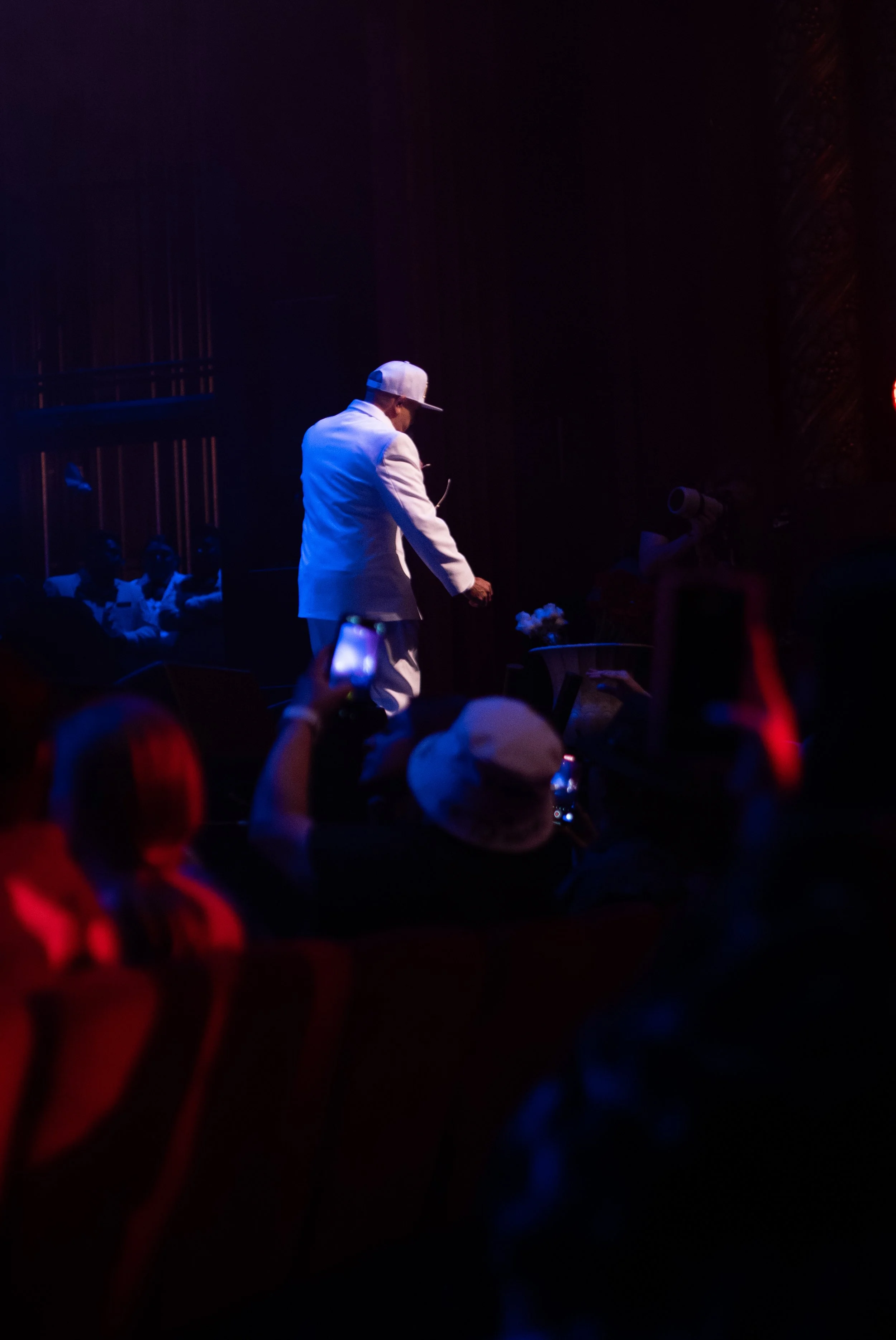 MC Magic performing on stage in front of a sold-out audience during the 30 Years of Magic concert in Phoenix