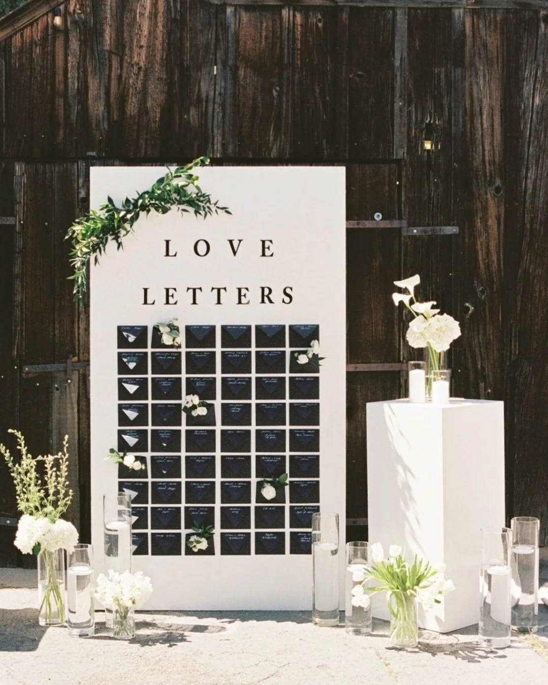 Each guest found their seat by finding an envelope with their name on it, handwritten in calligraphy and filled with a little love letter waiting inside. Simple, thoughtful, and something guests could take home with them. I love when seating charts d