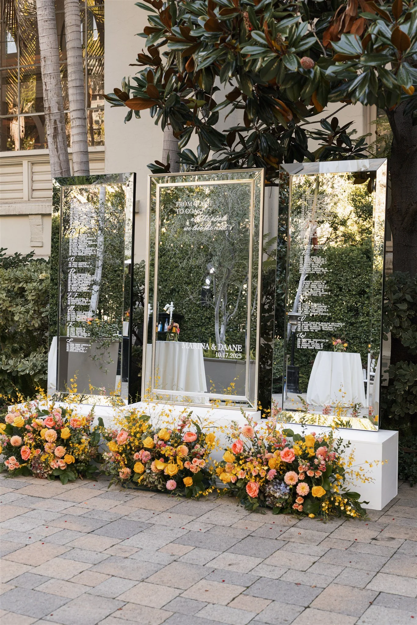southern california wedding seating chart using calligraphy on mirror