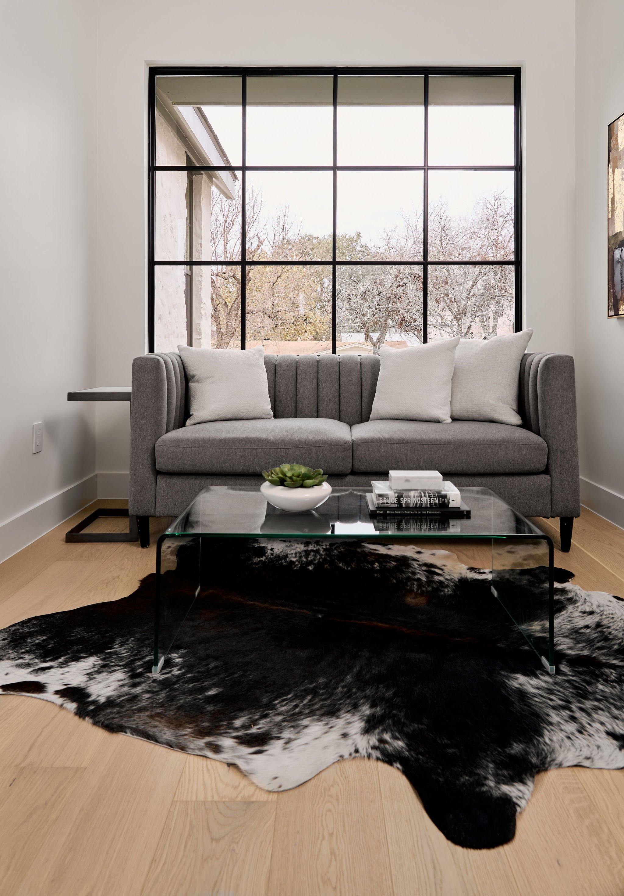 Upstairs sitting area with large window—perfect cozy spot in your dream Austin, TX home by Mission Home Builders.