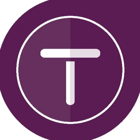 Icon of the letter T inside a circle with a purple background.